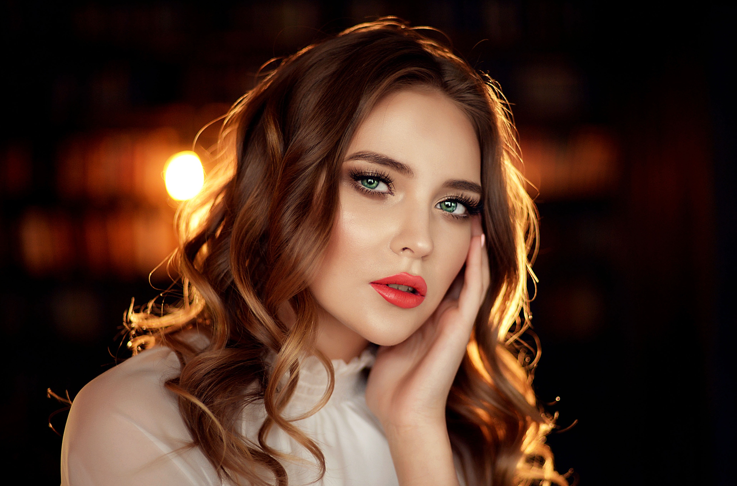 People 2560x1689 women green eyes face portrait lipstick closeup makeup white shirt touching face hand on face curly hair looking at viewer 500px brunette red lipstick sensual gaze