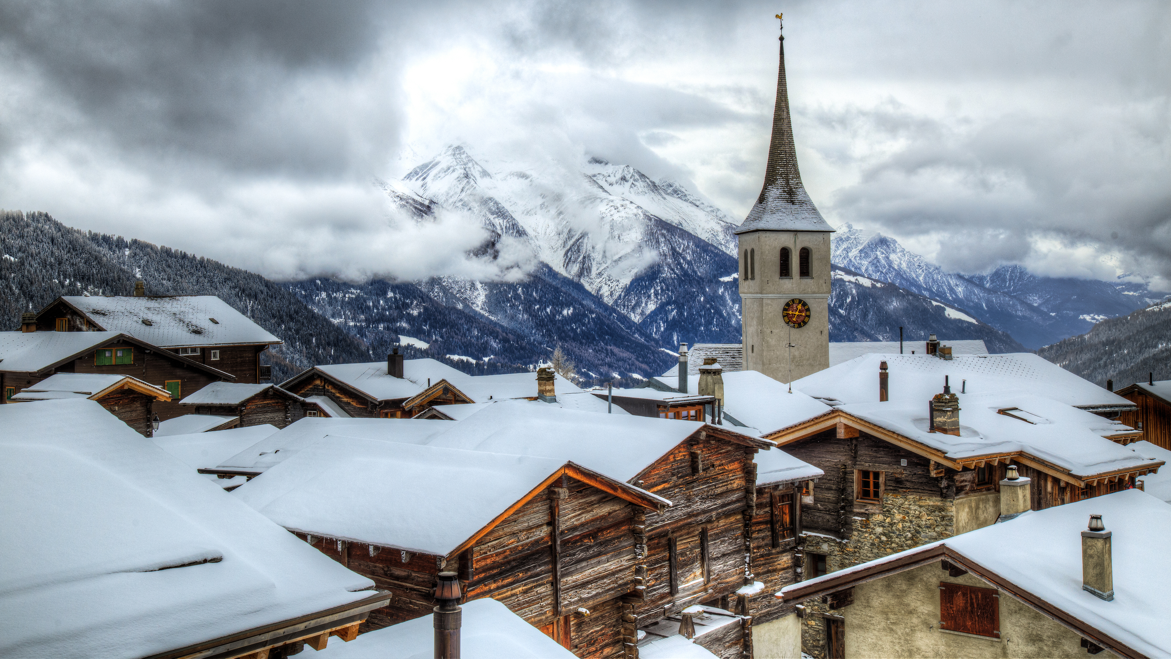 General 3840x2160 winter snow rooftops Austria Hallstatt snowy peak snow covered clouds mountains village architecture building church house sky overcast