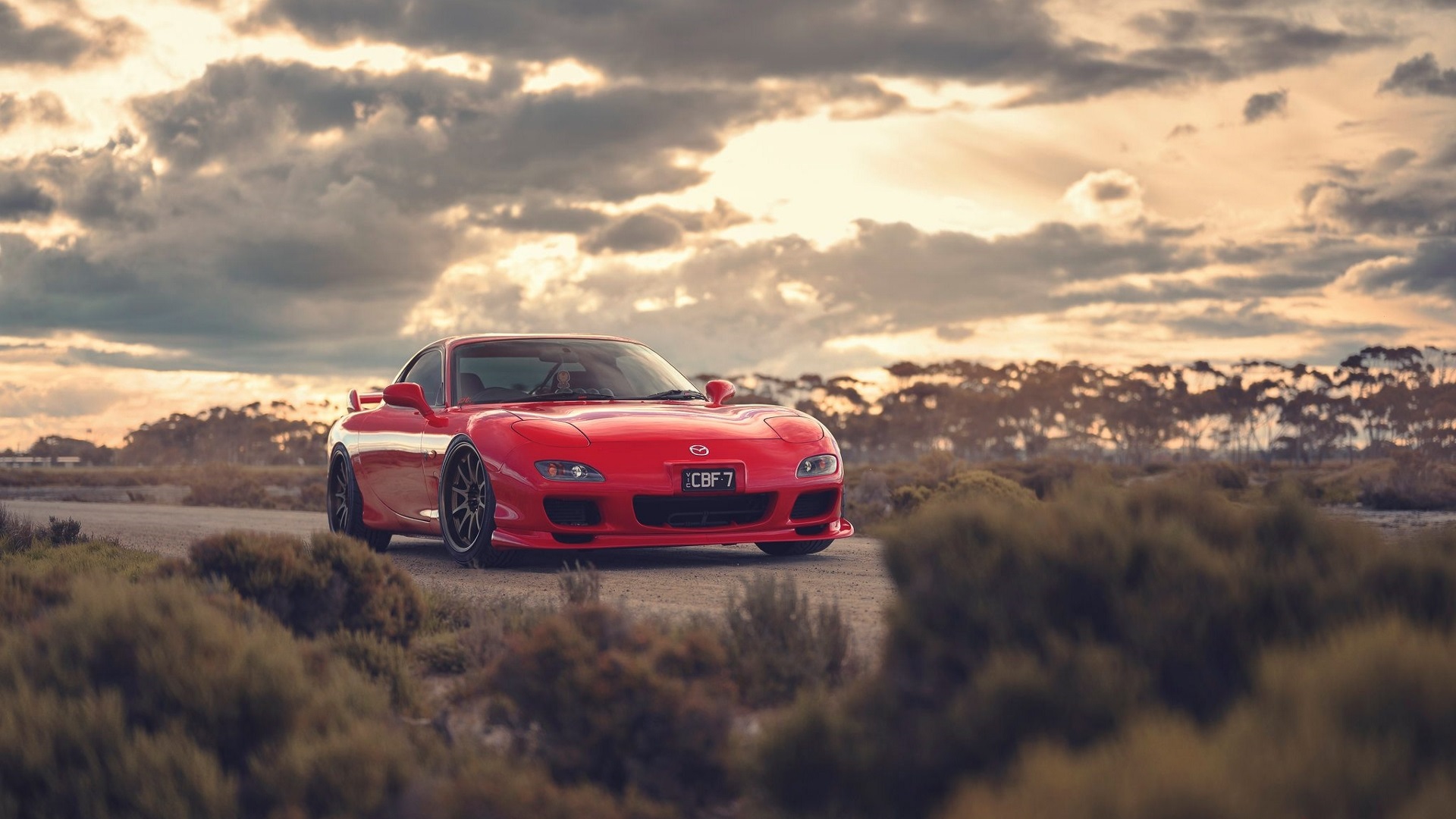 General 1920x1080 Mazda RX-7 Mazda Japanese cars red cars car vehicle sports car sky clouds sunset bushes trees pop-up headlights outdoors PT works