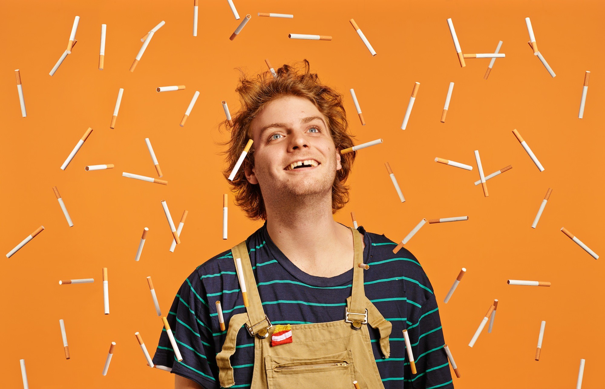 People 2000x1287 music Mac Demarco cigarettes orange humor smiling orange background redhead looking away looking into the distance musician singer men