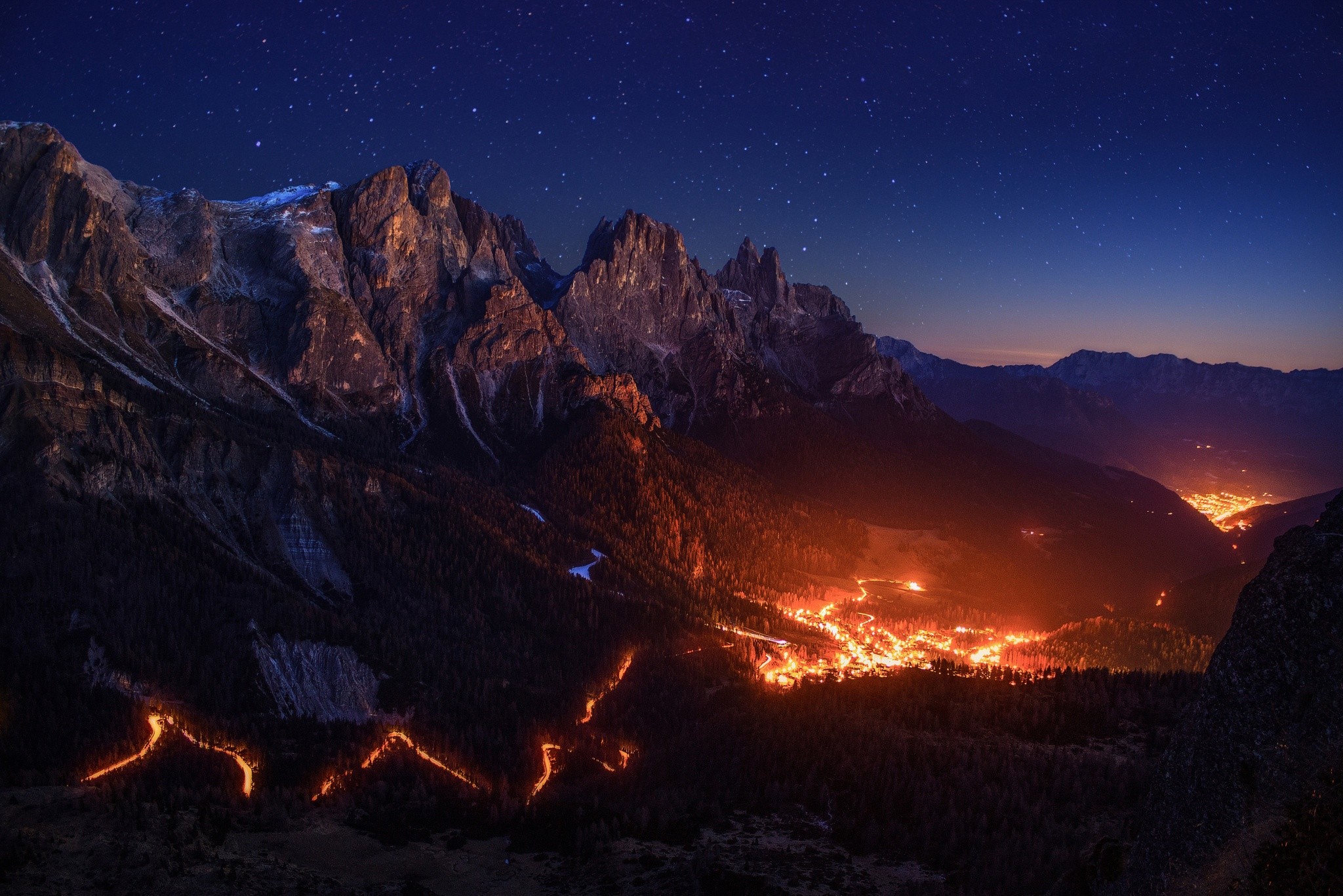 General 2048x1367 fire stars sky night valley mountains Alps lights low light road hairpin turns