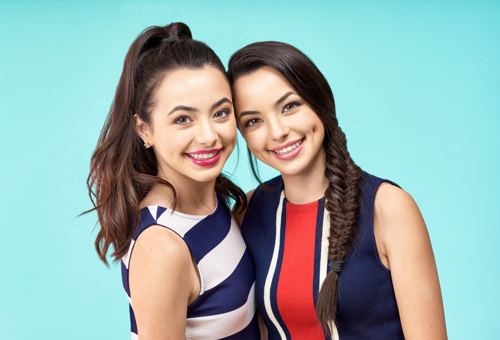 People 2000x1363 The Merrell Twins Vanessa Merrell Veronica Merrell women model simple background twins blue background two women ponytail braids sisters