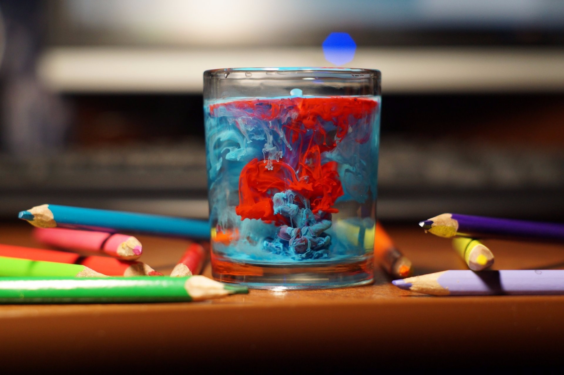 General 1920x1276 colorful pencils glass cyan red closeup indoors paint in water