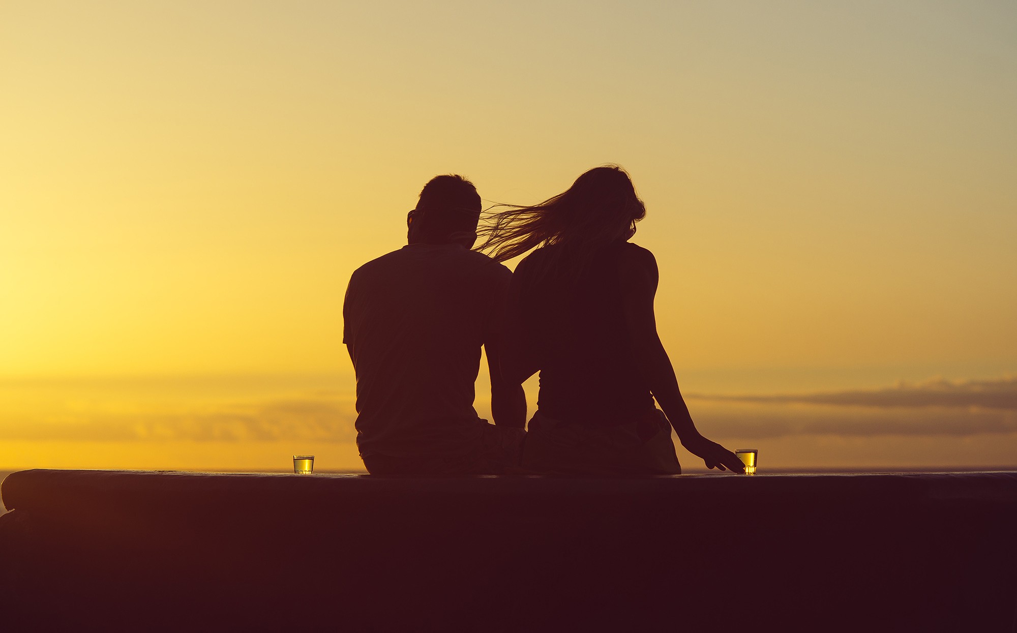 People 2000x1245 beach sunset men women water dusk silhouette couple women outdoors men outdoors sky sitting