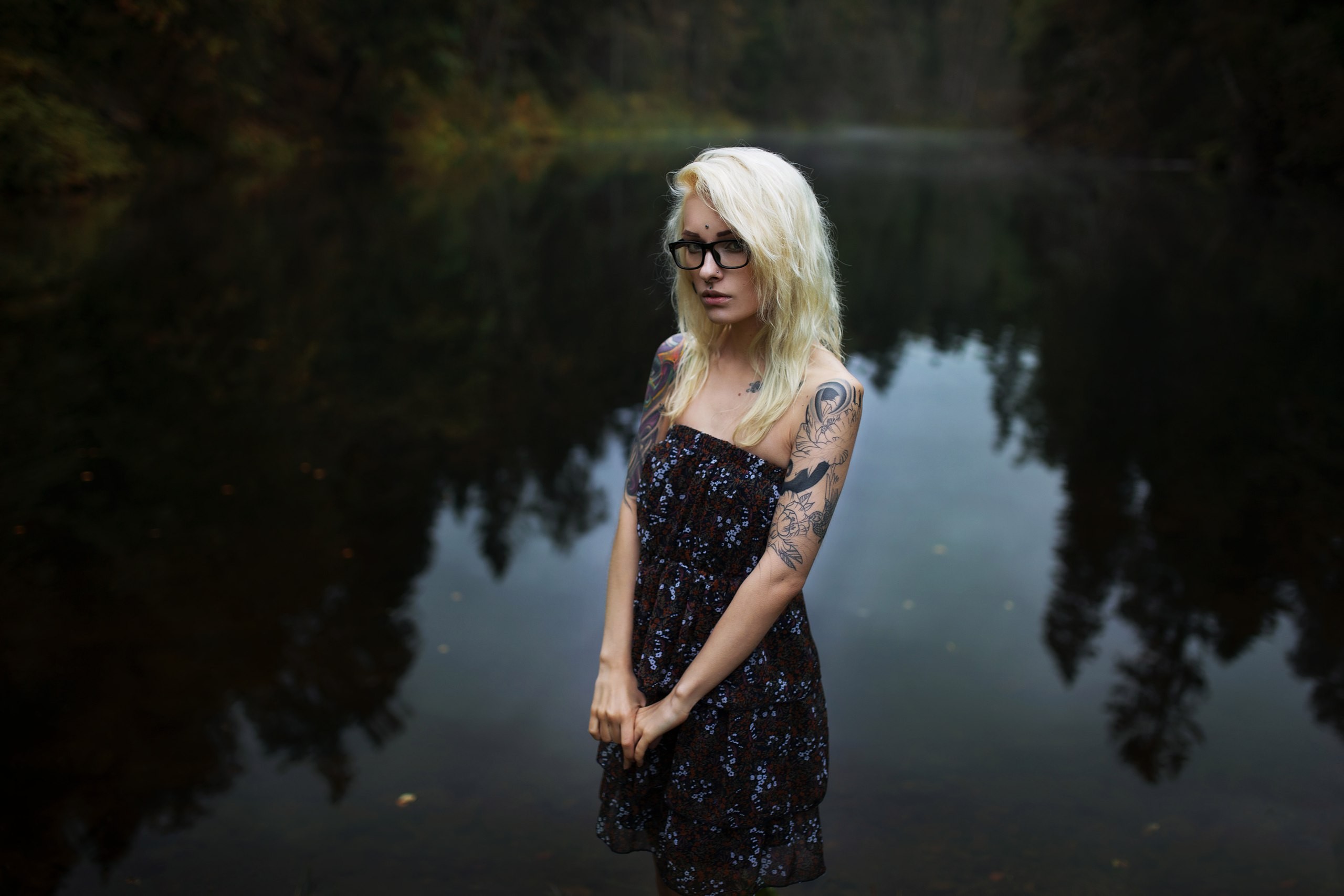 People 2560x1707 Sasha Brink women lake dress women with glasses tattoo water reflection portrait glasses piercing pierced nose depth of field bare shoulders flower dress inked girls women outdoors outdoors looking at viewer blonde