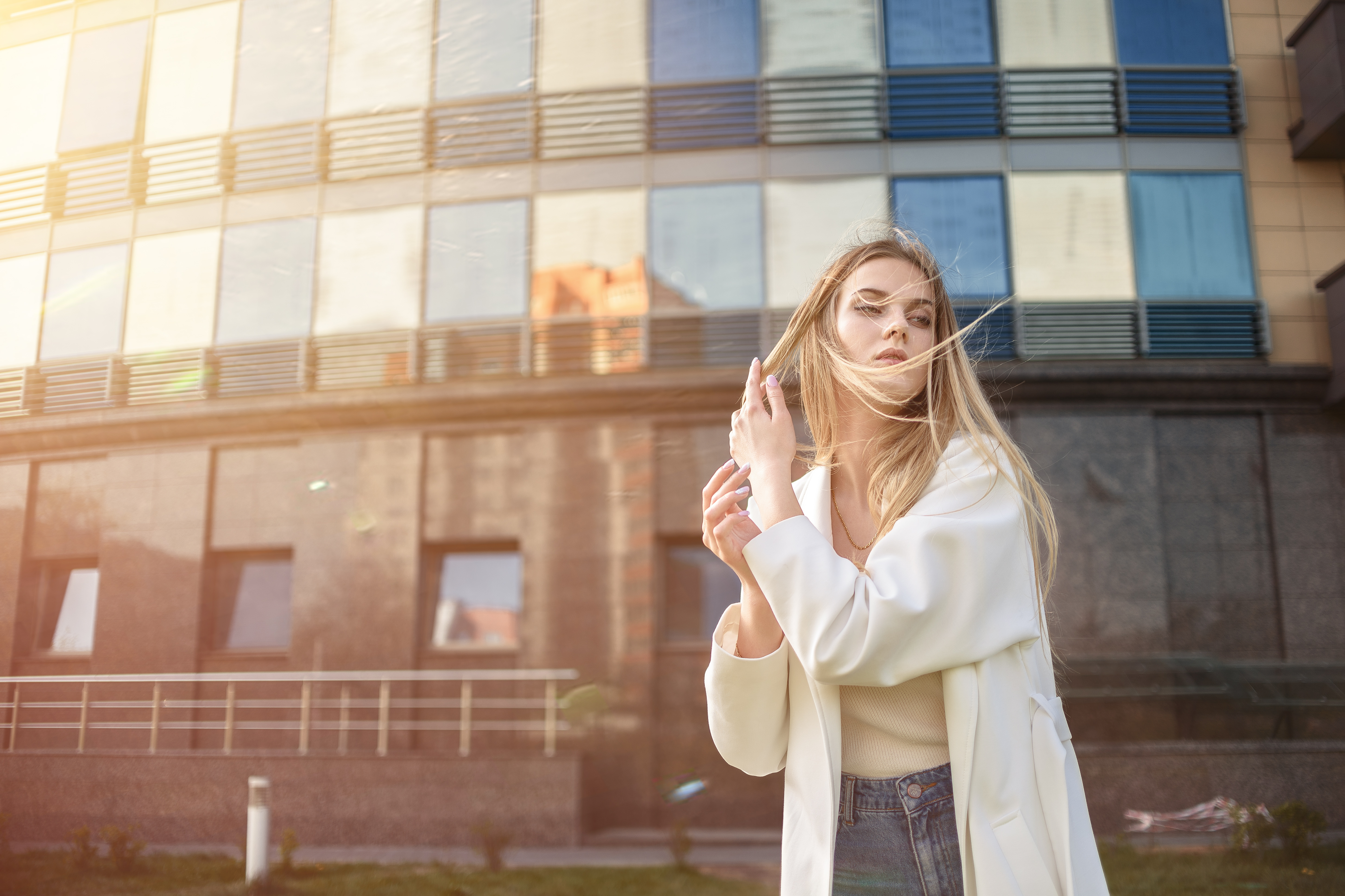 People 5806x3871 women Dmitry Medved blonde jeans white coat coats windy hair in face overcoats hair blowing in the wind urban open coat women outdoors looking away long hair model white clothing