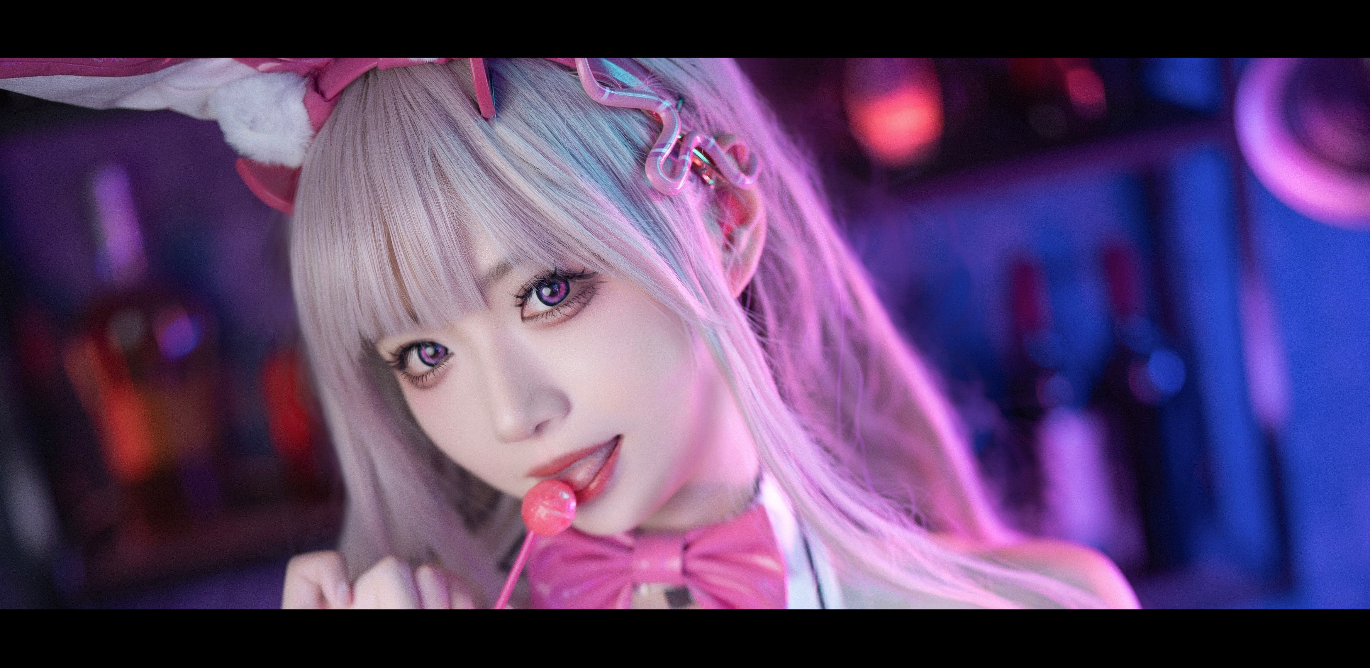 People 4672x2277 cosplay Asian women Borusushi Nikke: The Goddess of Victory bunny suit bunny ears lollipop looking at viewer blurry background face tongue out head tilt hair ornament long hair ultrawide tongues