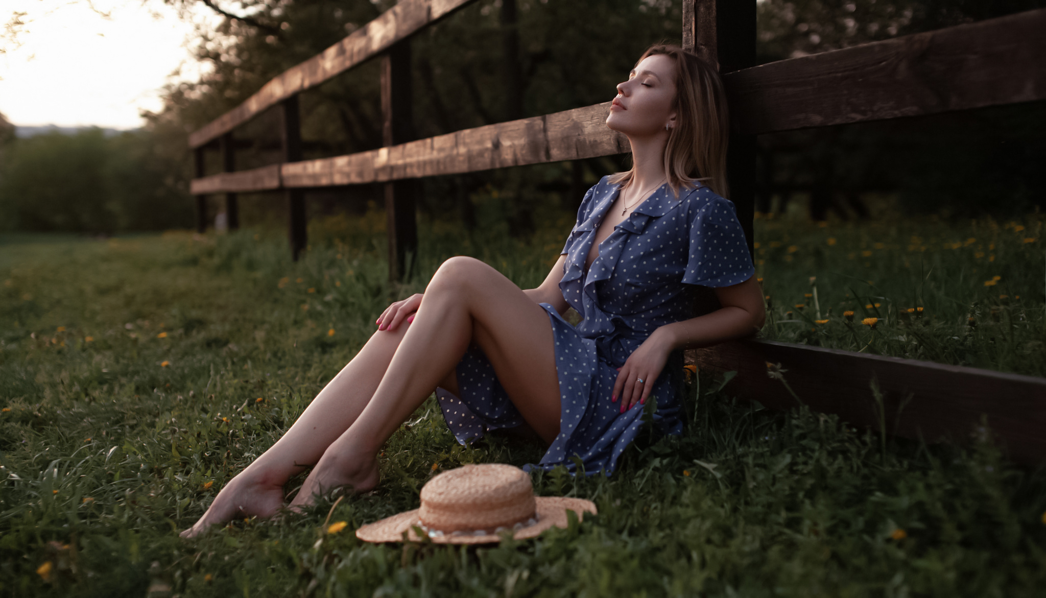 People 2048x1171 Andrey Frolov women blonde closed eyes dress barefoot legs dots blue clothing hat grass women outdoors outdoors polka dots fence sensual gaze sitting blue dress painted nails pink nails brunette