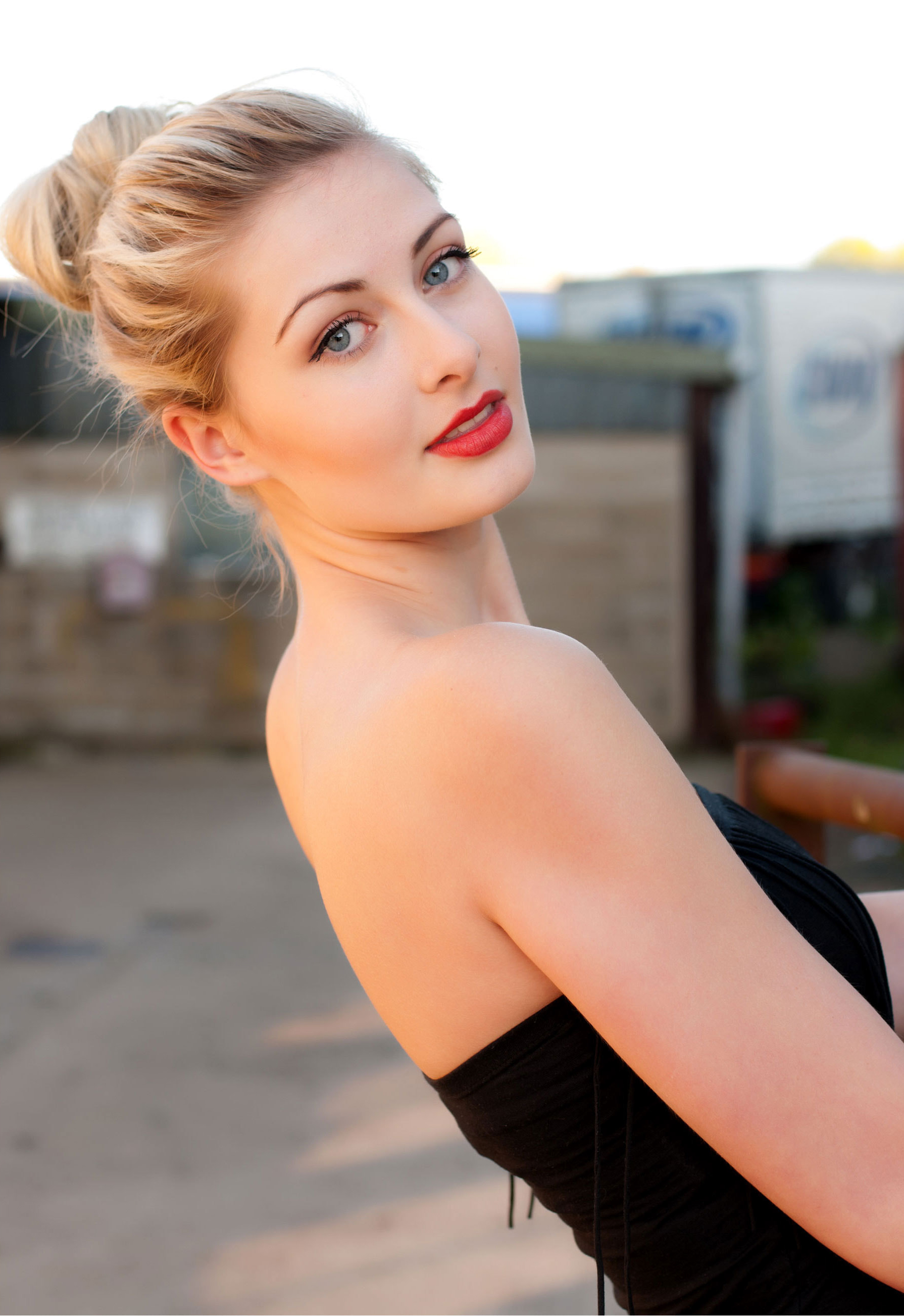 People 1790x2604 looking at viewer bare shoulders model women outdoors blonde red lipstick black dress women gray eyes glamour girls glamour makeup strapless dress hairbun tied hair outdoors Caucasian young women solo open mouth