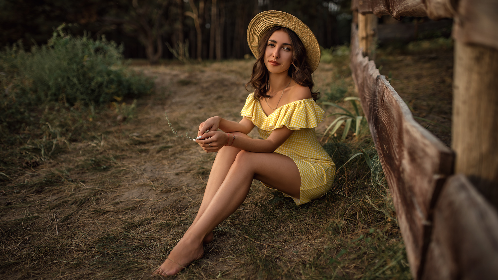 People 2000x1125 women skinny yellow dress women outdoors brunette polka dots hat fence necklace smiling trees sitting pointed toes
