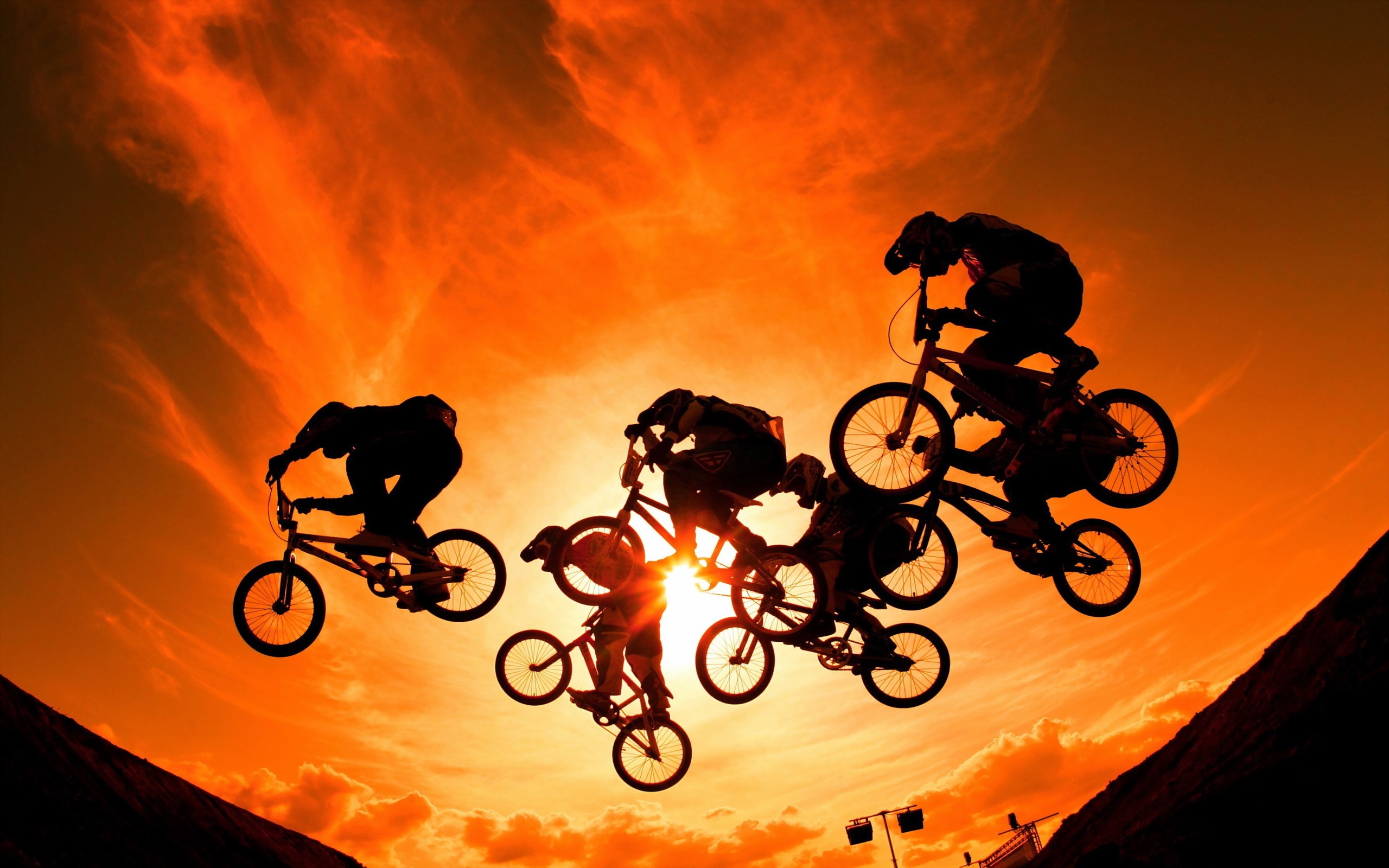 People 2560x1600 men bicycle Sun sport outdoors dark sunlight sky vehicle jumping