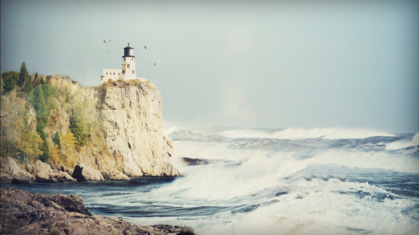 General 1366x768 lighthouse sea waves cliff coast lens flare nature