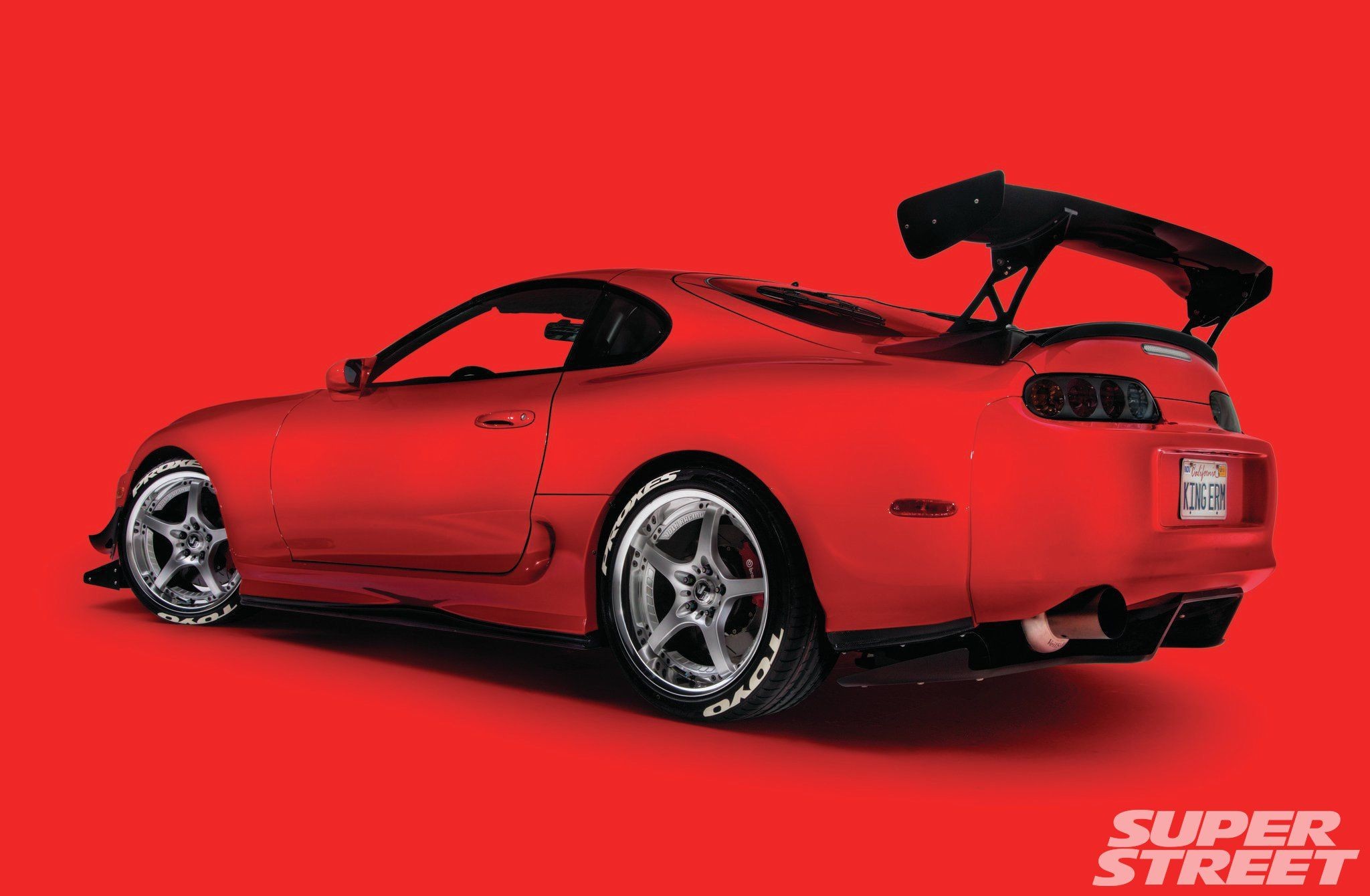 General 2048x1340 car vehicle red cars red background Toyota Supra Toyota car spoiler Japanese cars simple background watermarked