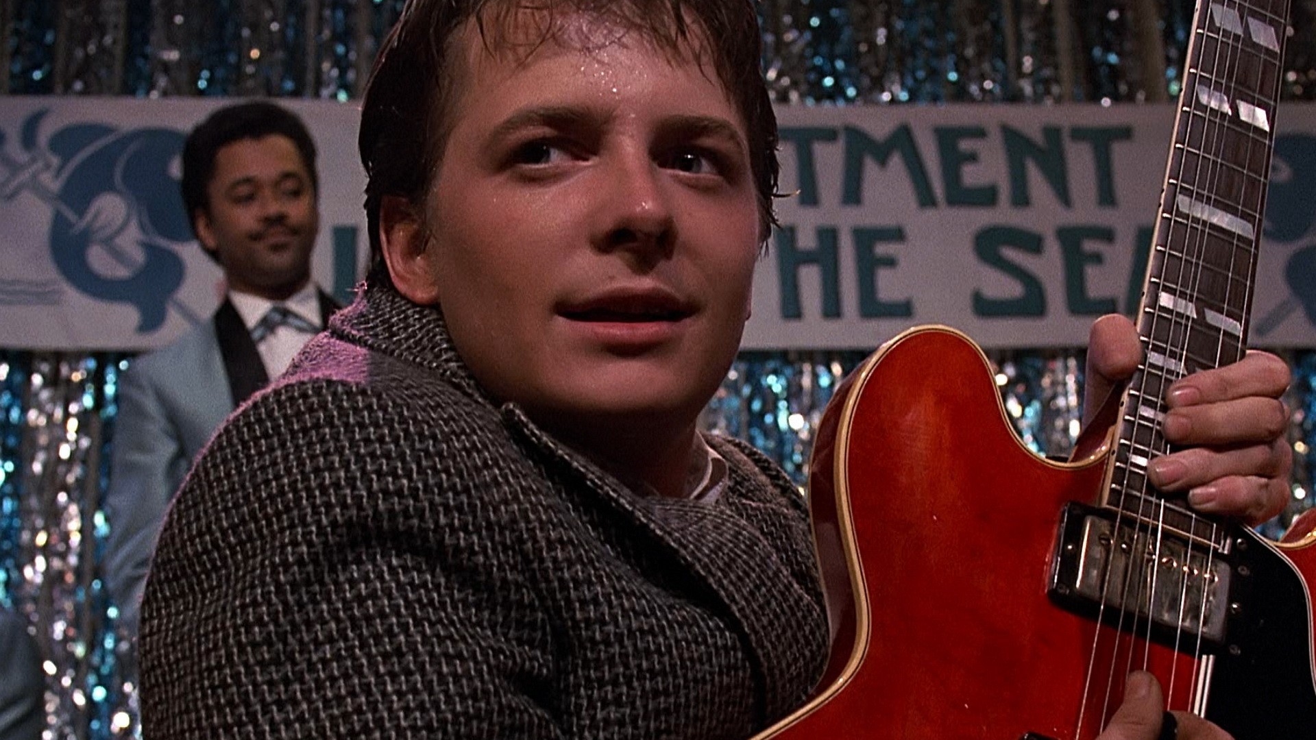 People 1920x1080 men actor movies film stills suits Back to the Future Michael J. Fox guitar music playing stages Marty McFly sweat musician electric guitar science fiction