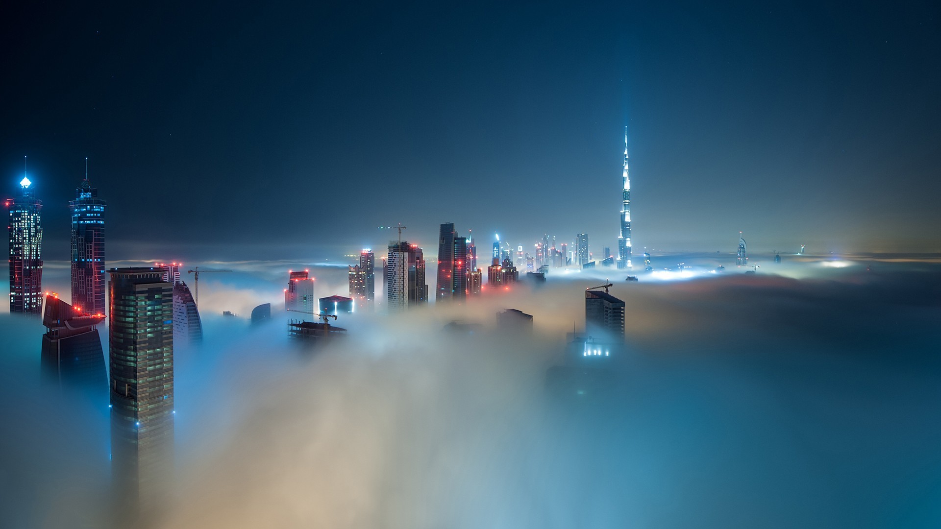 General 1920x1080 cityscape Dubai mist night skyscraper city blue United Arab Emirates sky city lights lights 500px Burj Khalifa building clouds