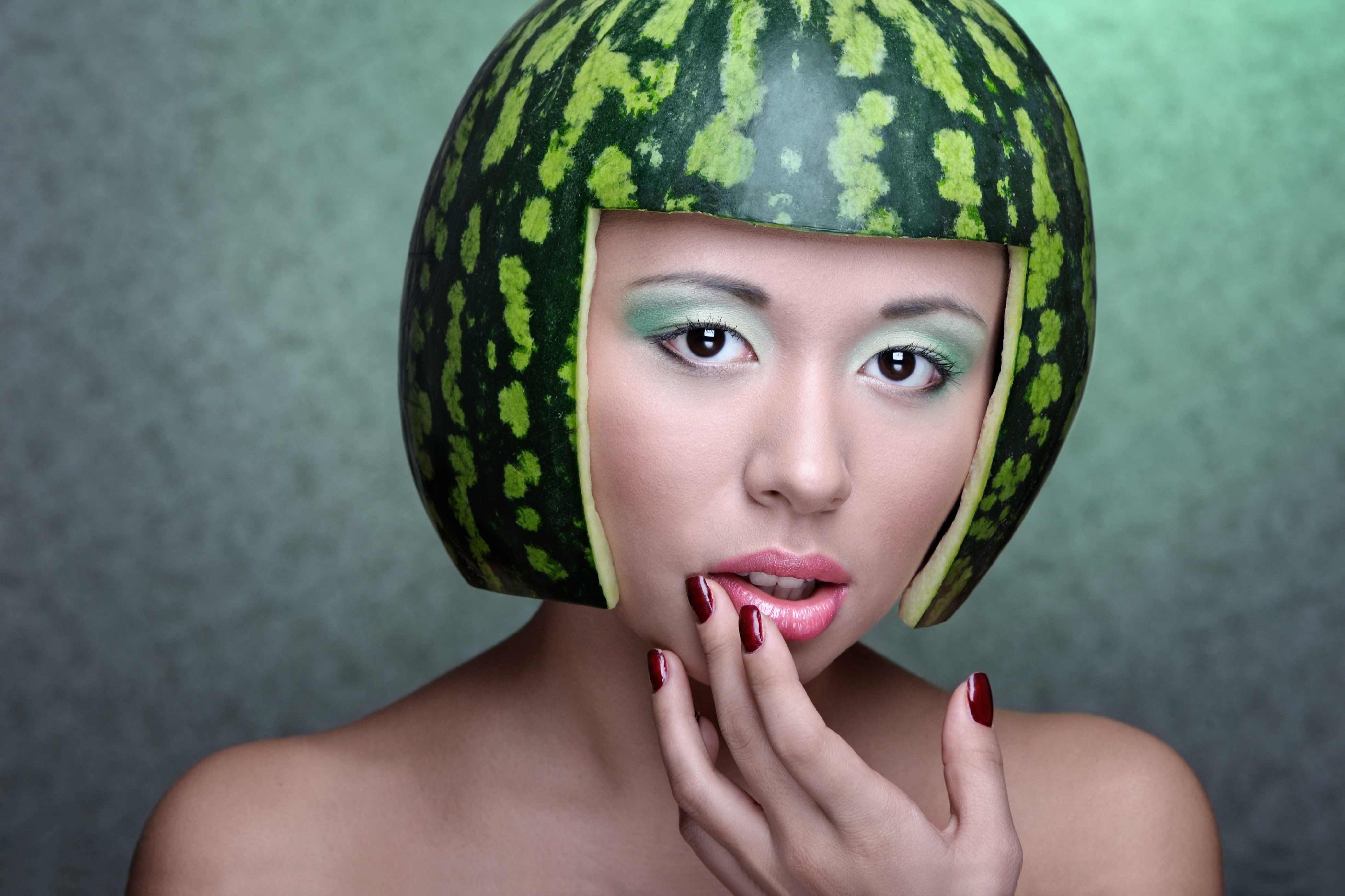 People 4152x2768 women model makeup funny hats red nails looking at viewer painted nails watermelons food fruit helmet humor closeup simple background teeth parted lips juicy lips