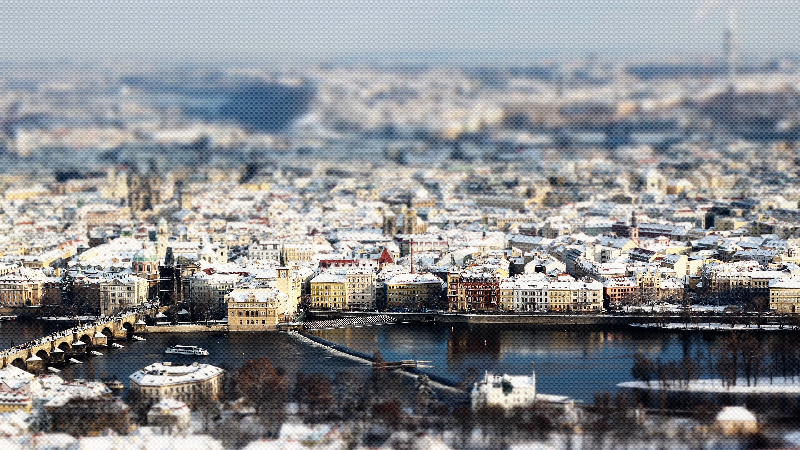 General 2560x1440 Prague river building tilt shift cityscape digital art rooftops winter snow