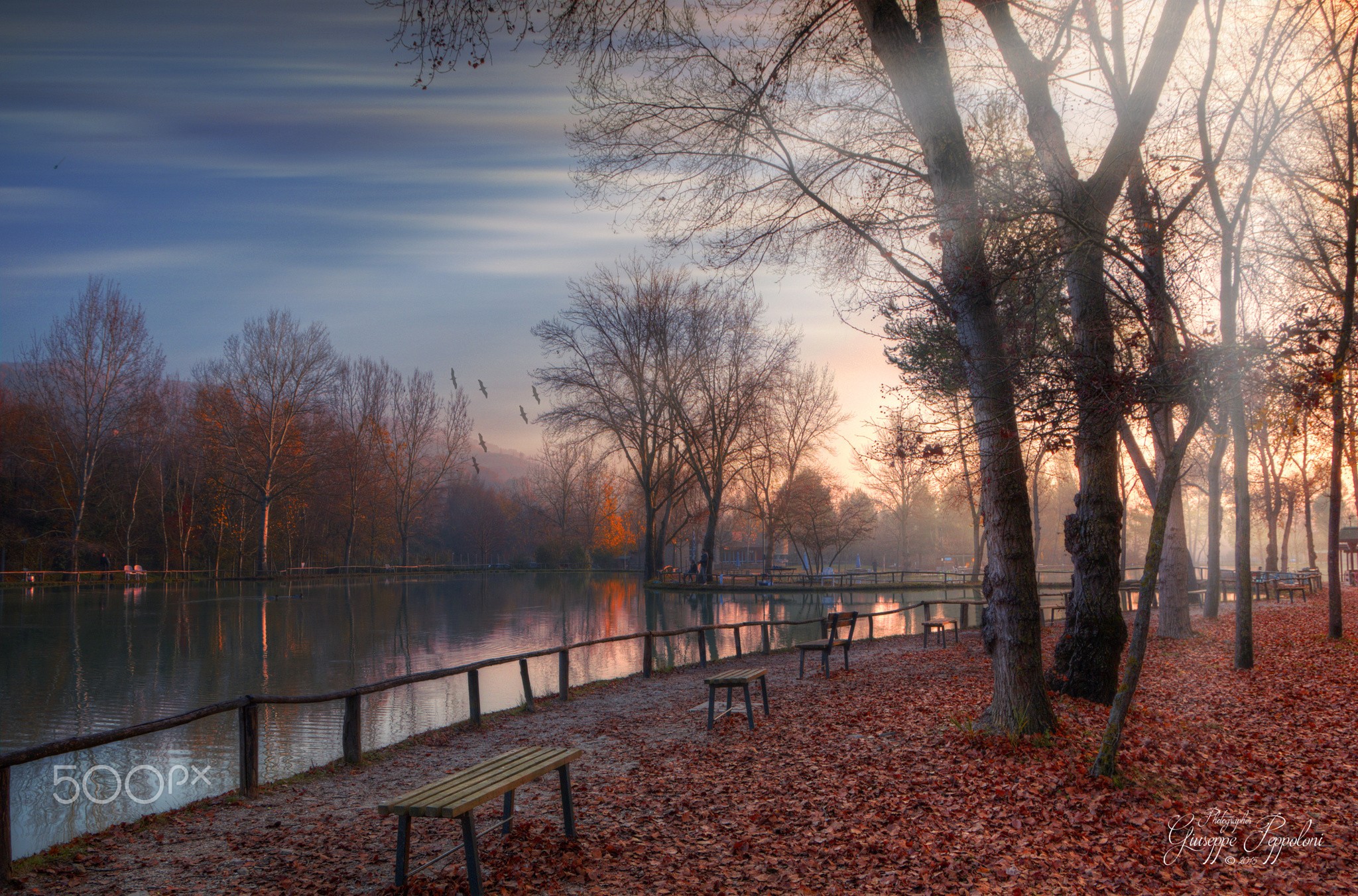 General 2048x1352 park lake bench fallen leaves outdoors sunlight water 500px watermarked