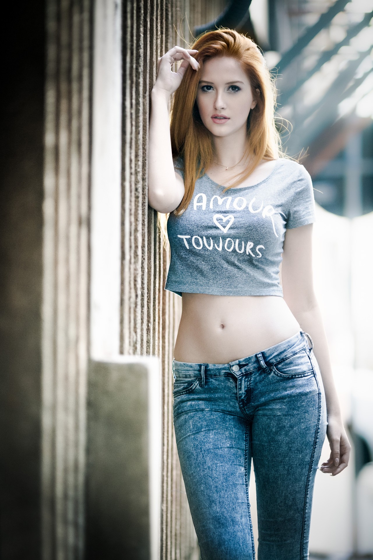People 1280x1920 women model jeans wall redhead T-shirt bare midriff belly standing looking at viewer women outdoors urban dyed hair pink lipstick