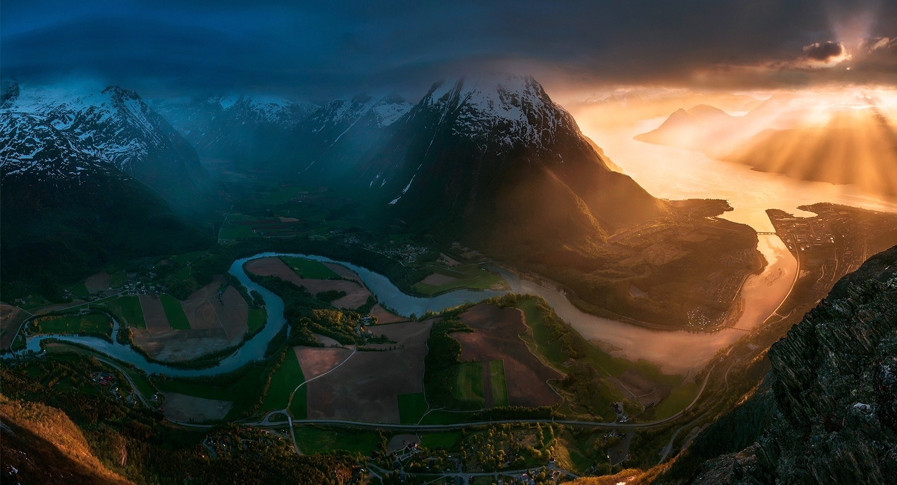 General 1782x964 sunset Norway field road mountains clouds sun rays town snowy peak bay valley nature landscape river panorama Max Rive sunlight