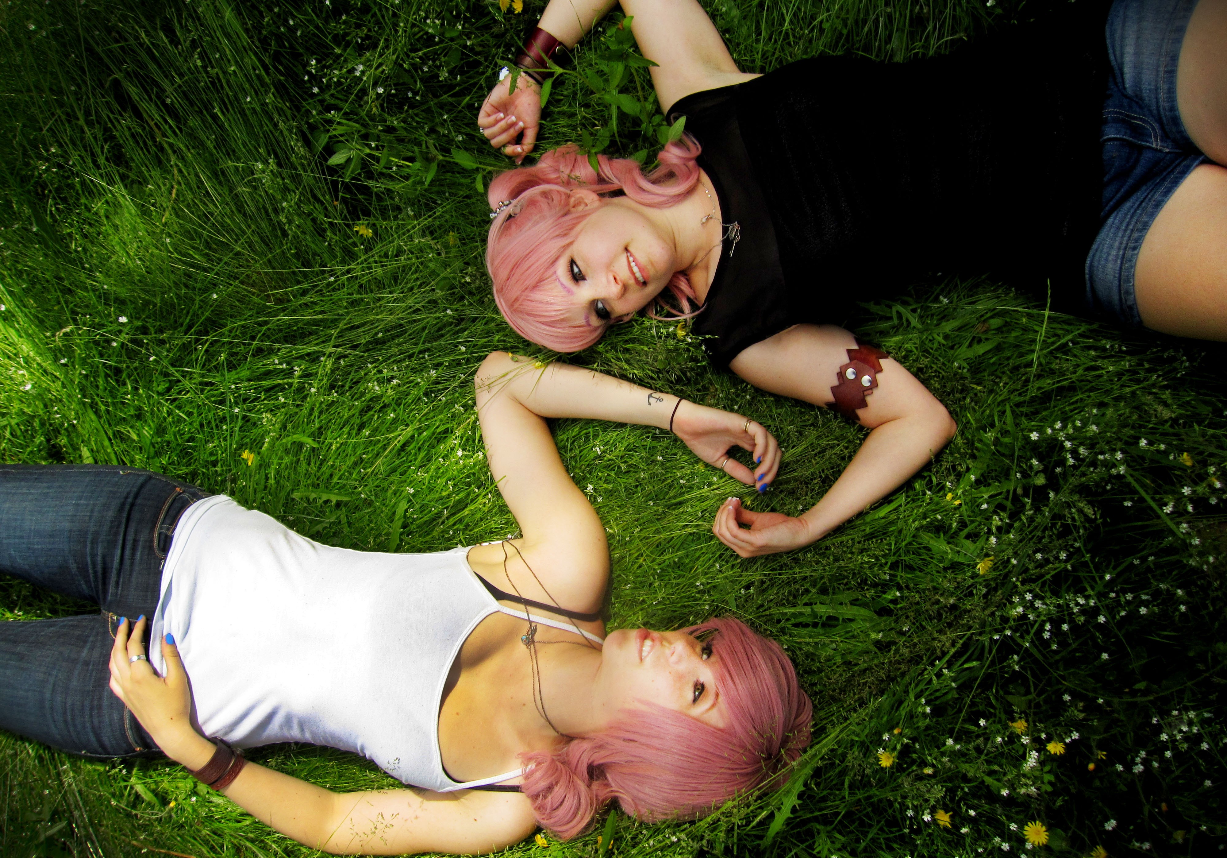 People 4000x2796 pink hair women women outdoors grass model smiling two women lying down