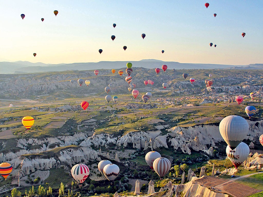 General 1024x768 hot air balloons Cappadocia landscape valley rock formation vehicle Turkey