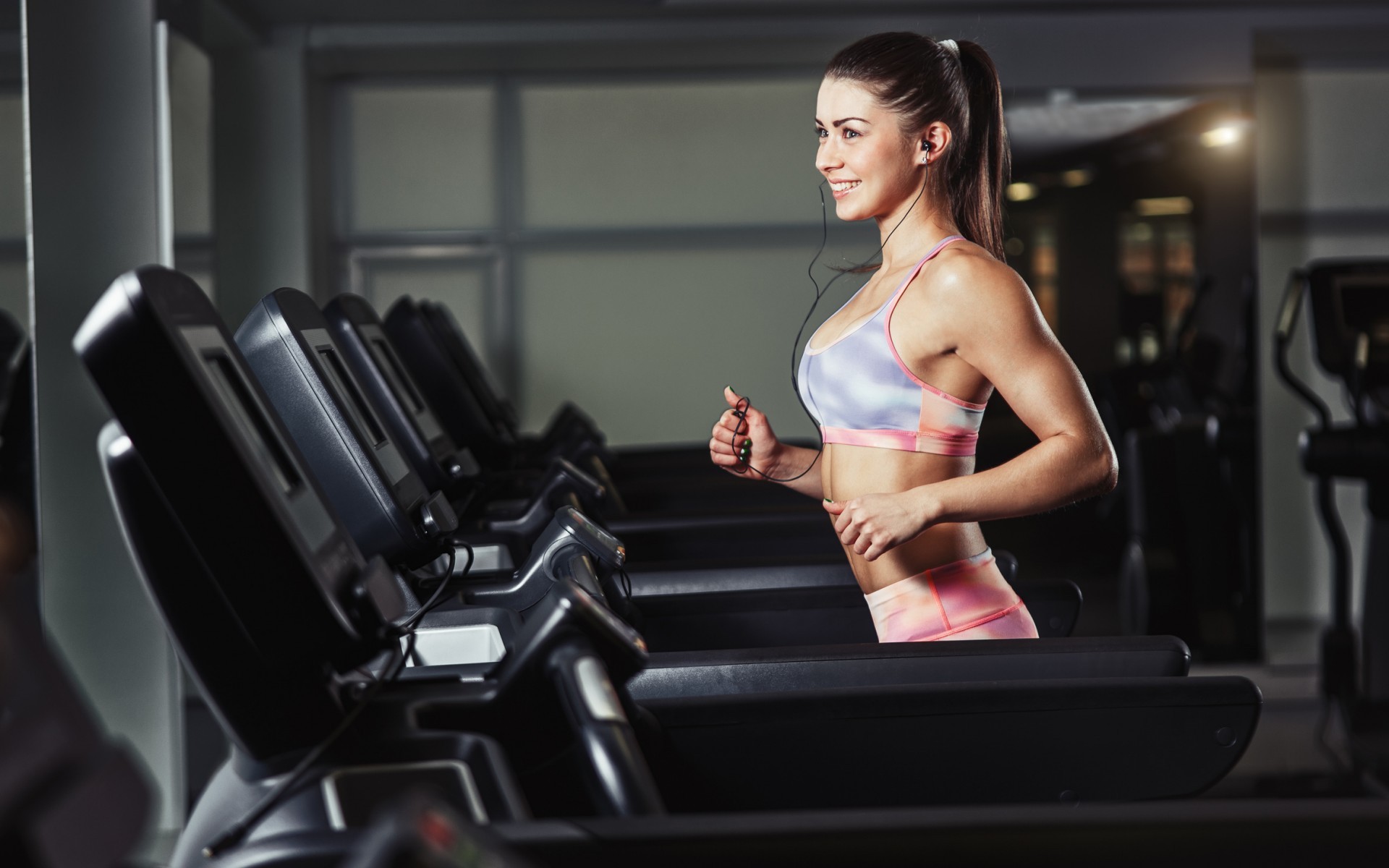 People 1920x1200 women model brunette long hair sports bra gyms gym clothes running smiling skinny treadmills ponytail women indoors indoors sport working out exercise bra earphones looking into the distance