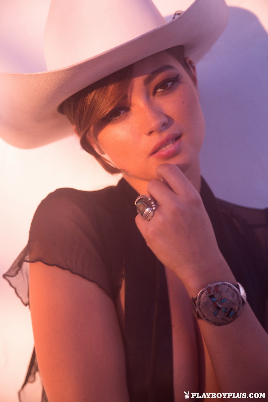 People 1067x1600 Chelsie Aryn Playboy women cowboy hats Playboy Plus watermarked hat women with hats rings face makeup looking at viewer Playmate brunette Playmate of the Month March 2015 (Year) portrait display