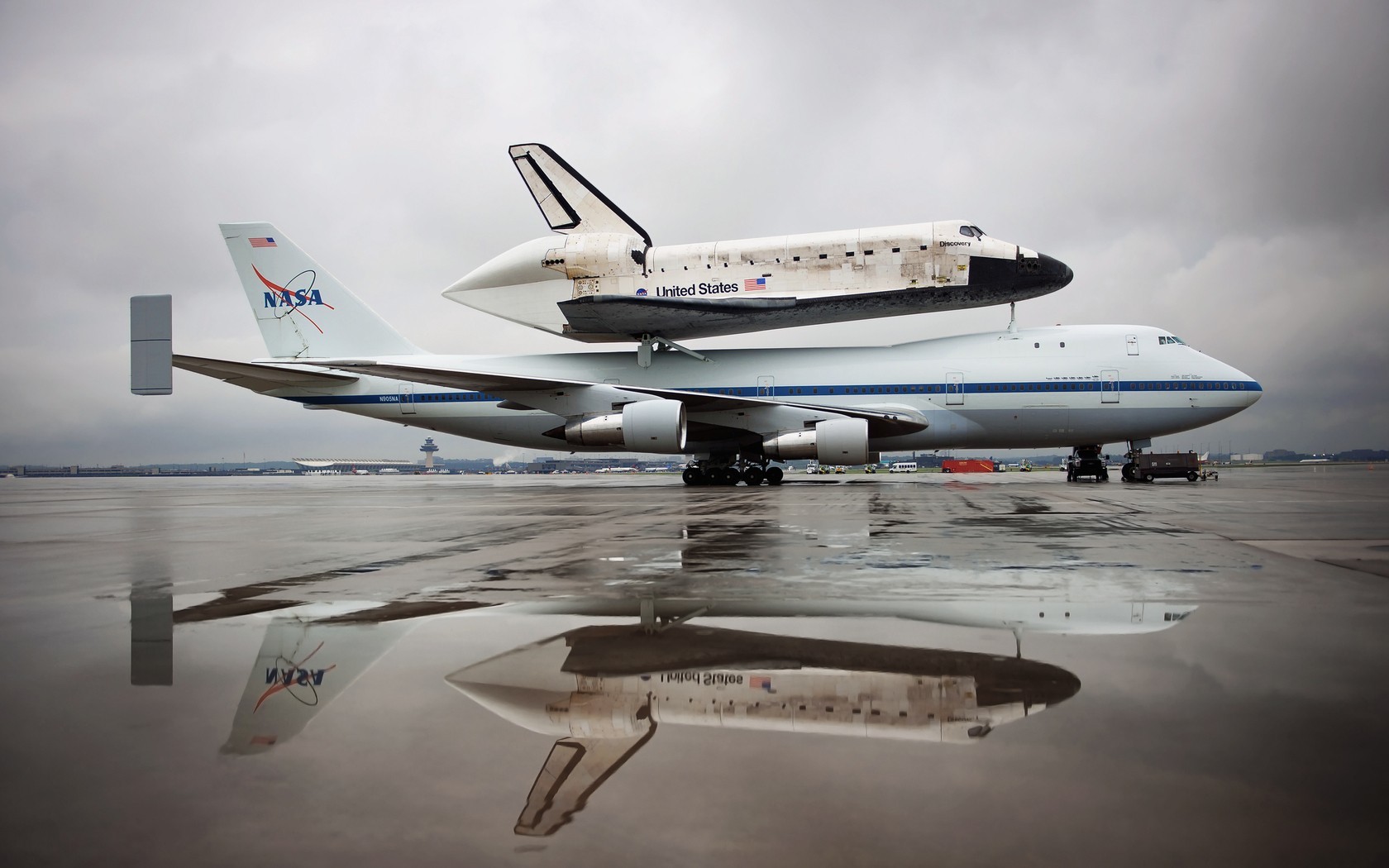 General 1680x1050 NASA Boeing 747 Space Shuttle Discovery aircraft reflection American aircraft vehicle side view space shuttle sky clouds water puddle