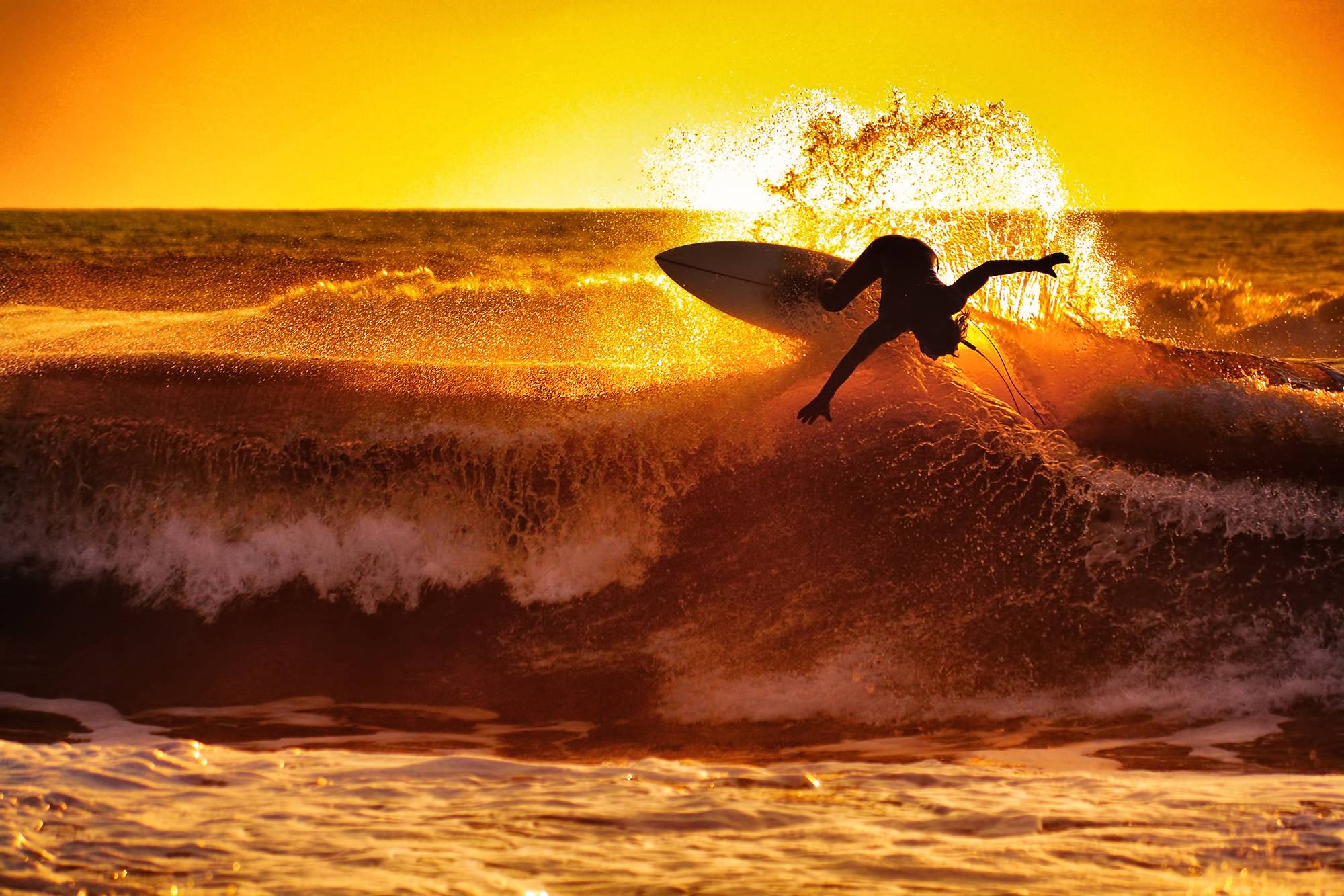General 2000x1333 surfing waves sunset sea sunlight water sport outdoors low light