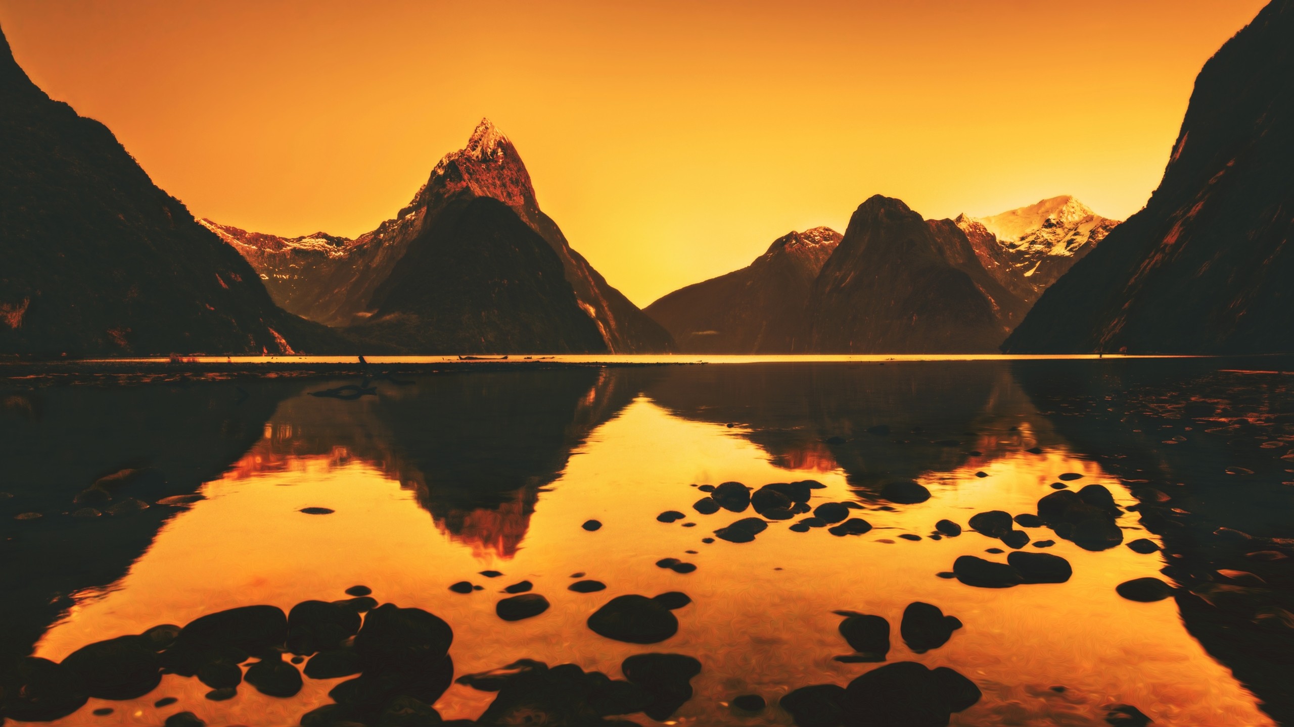 General 2560x1440 photography nature landscape orange reflection lake mountains hills rocks calm New Zealand Milford Sound