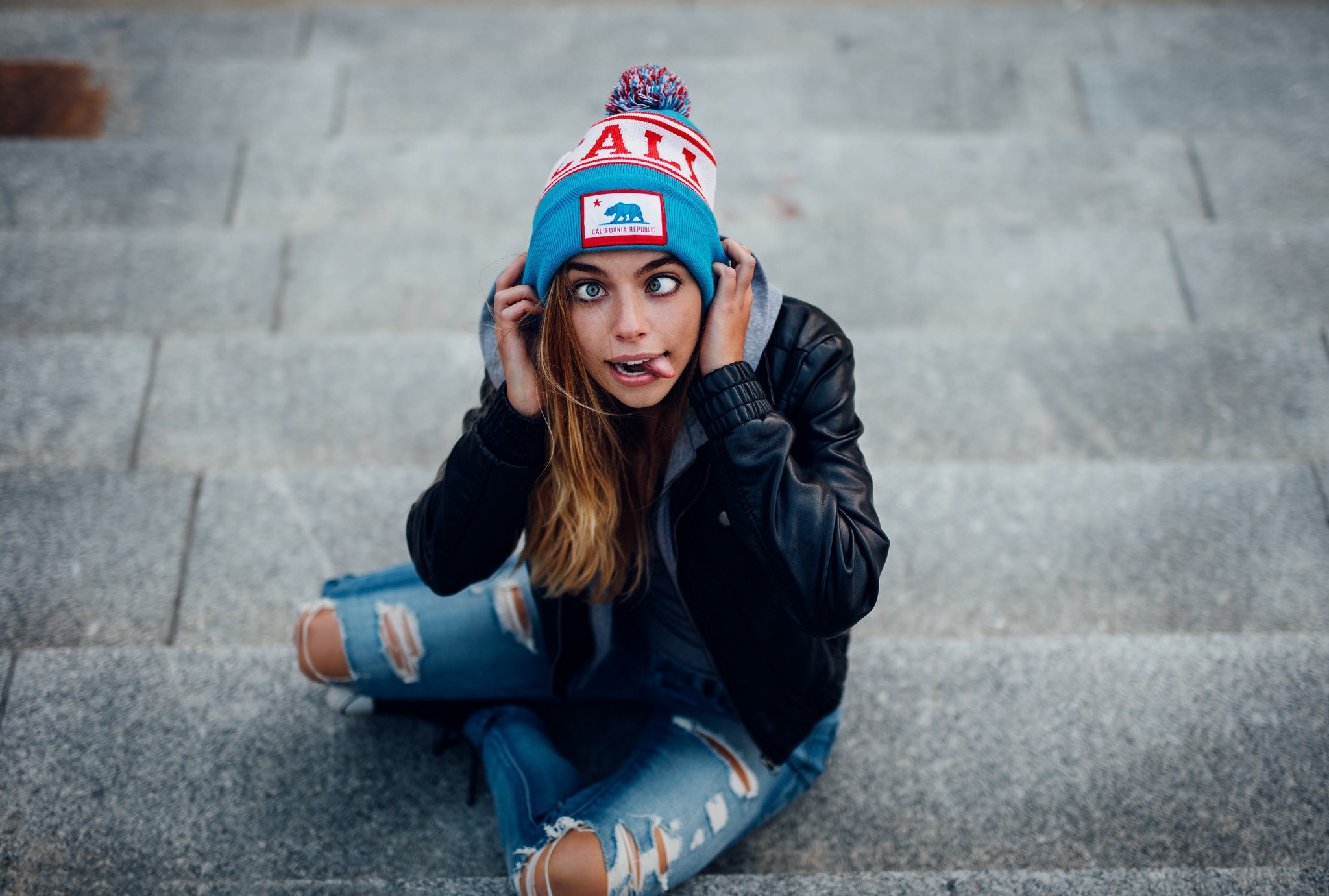 People 2048x1381 black blue clothing women model stairs tongues face jeans blue eyes woolly hat torn jeans open mouth Marta Piekarz high angle crosseyed wacky wool cap hat women with hats torn clothes women outdoors urban tongue out Polish women Polish model Marta (model)