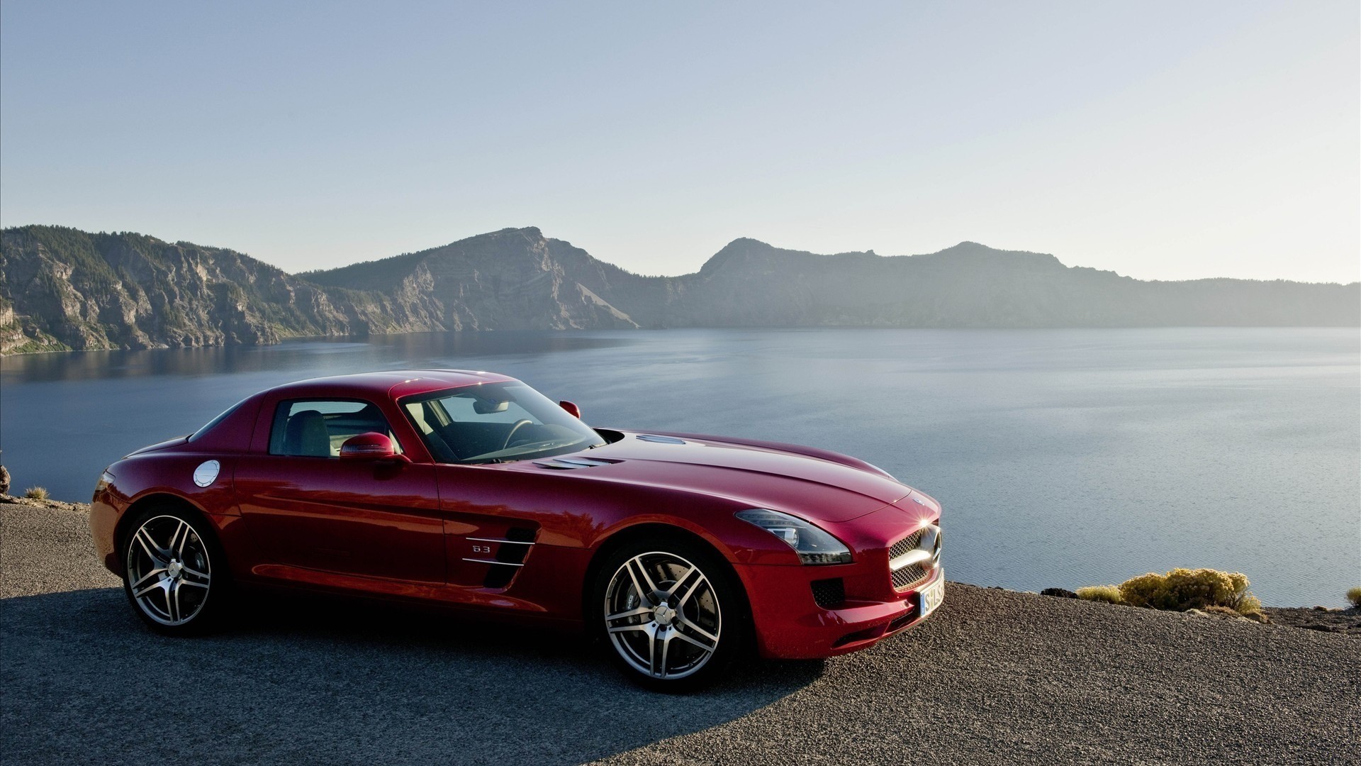 General 1920x1080 Mercedes-Benz red cars vehicle landscape car water outdoors Mercedes-Benz SLS AMG sky sunlight ground side view headlights licence plates
