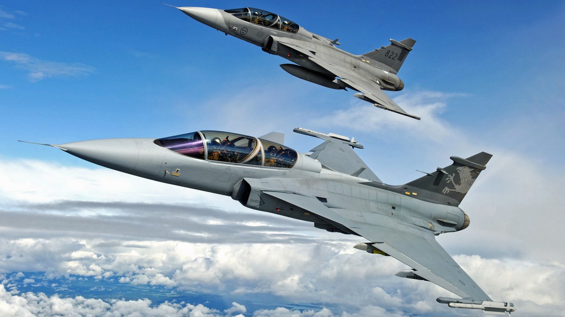 General 1920x1080 military aircraft military Swedish Swedish aircraft jet fighter aircraft sky JAS-39 Gripen clouds flying men helmet missiles