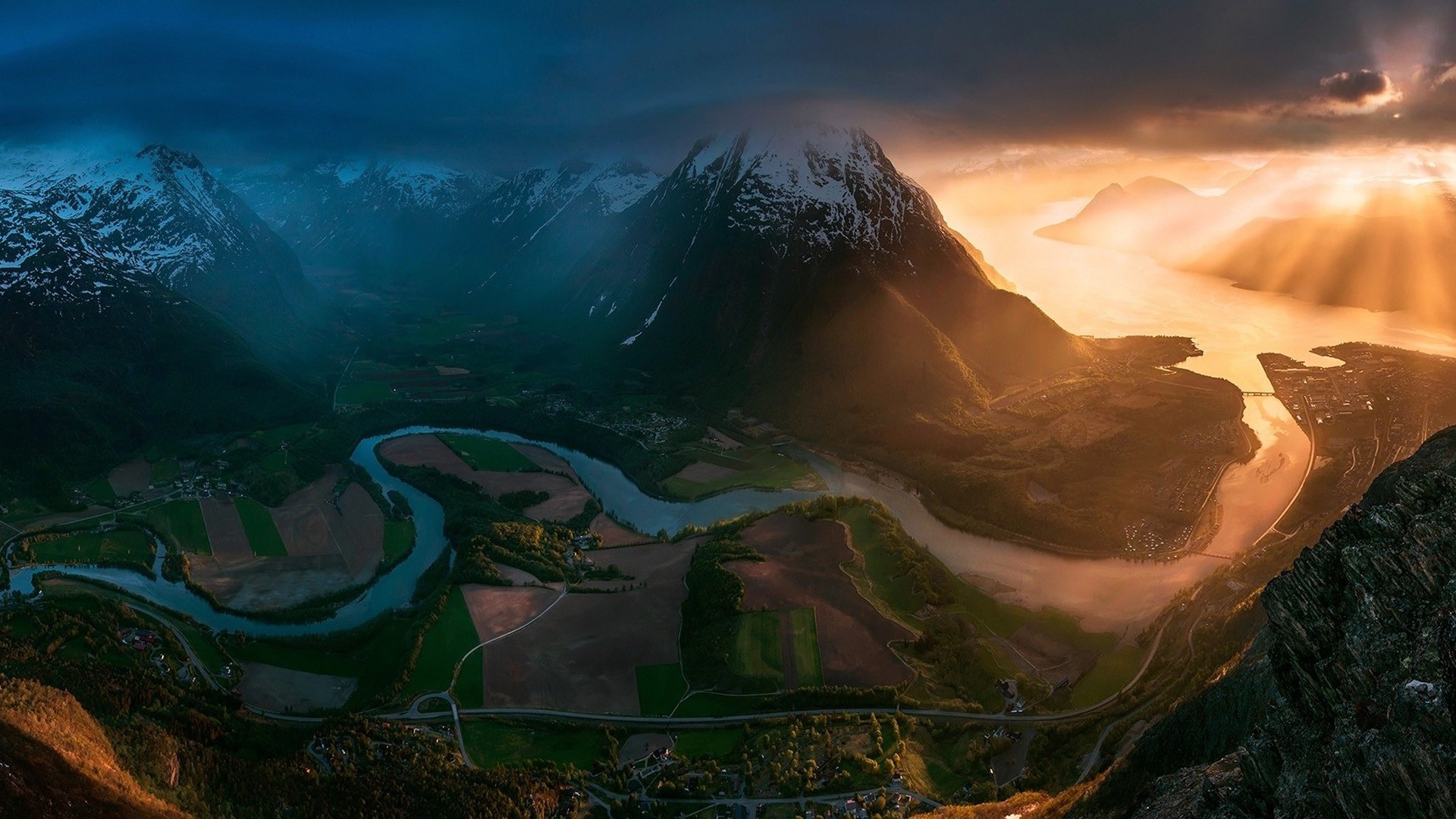 General 1920x1080 river landscape valley aerial view overcast sunset contrast sun rays 500px mountains snowy peak Max Rive Norway