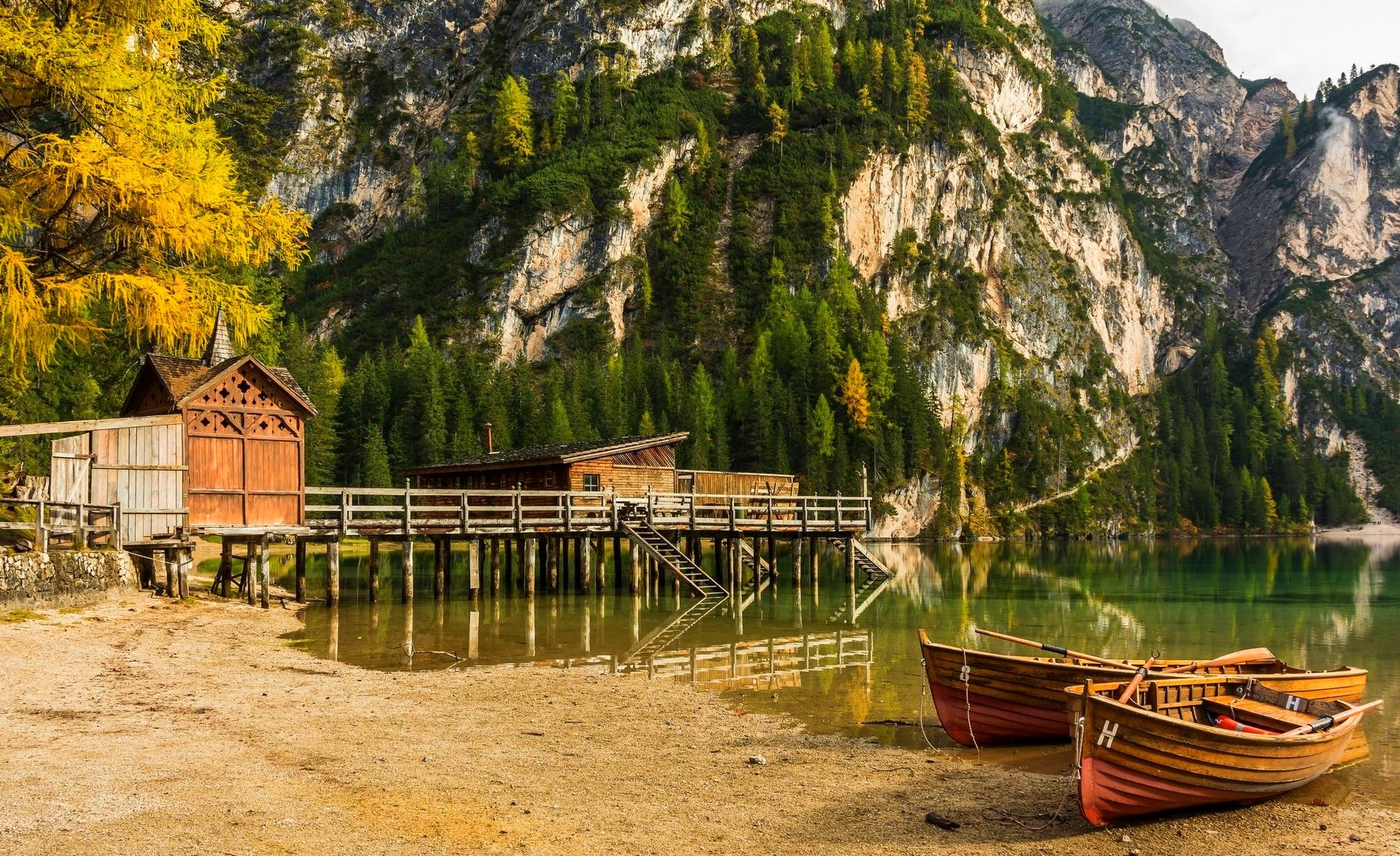 General 1920x1175 boat dock lake mountains beach forest cliff Alps trees Italy nature outdoors vehicle rocks