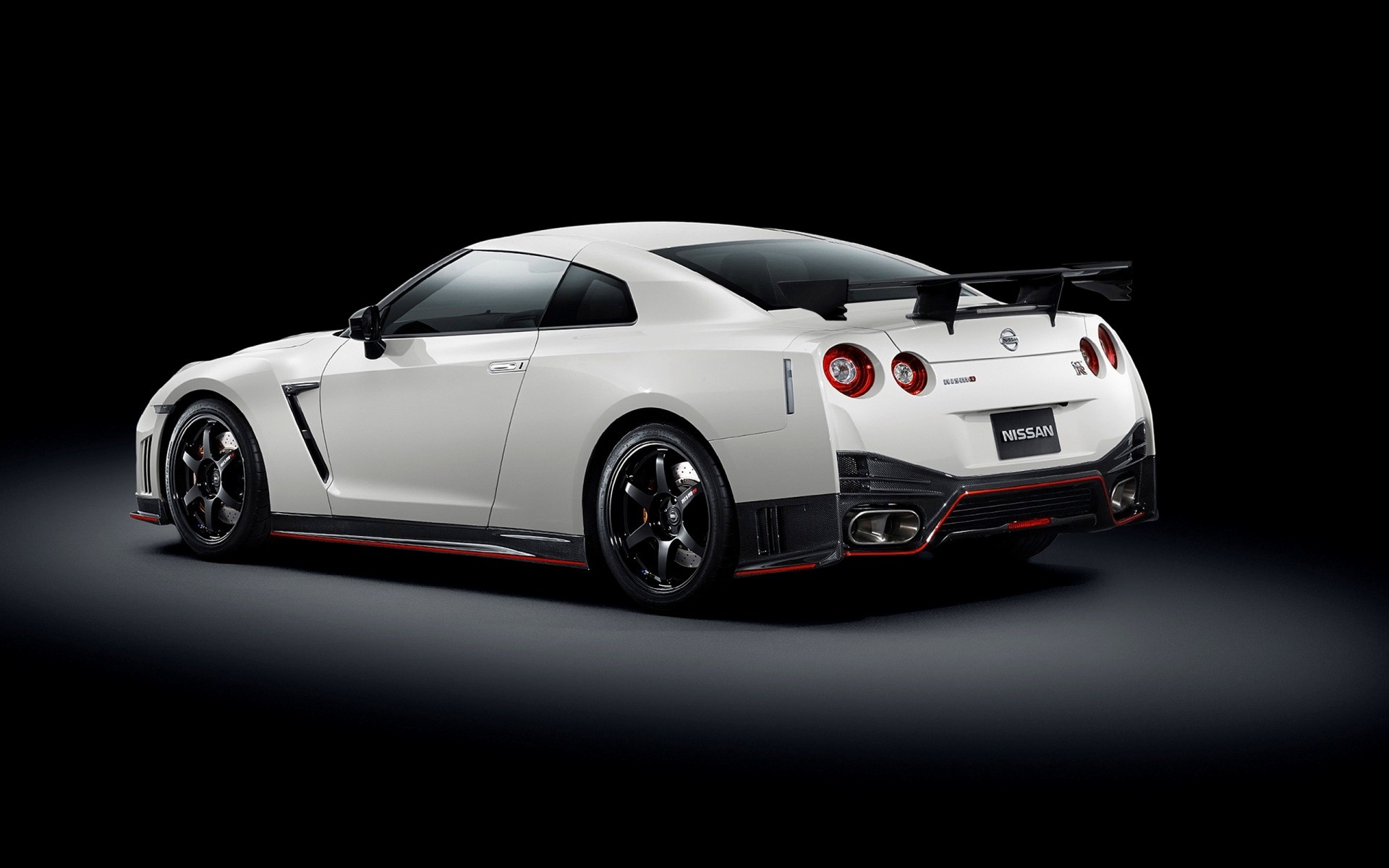General 1920x1200 Nismo Nissan GT-R car black background white cars vehicle Japanese cars rear view simple background Nissan licence plates taillights