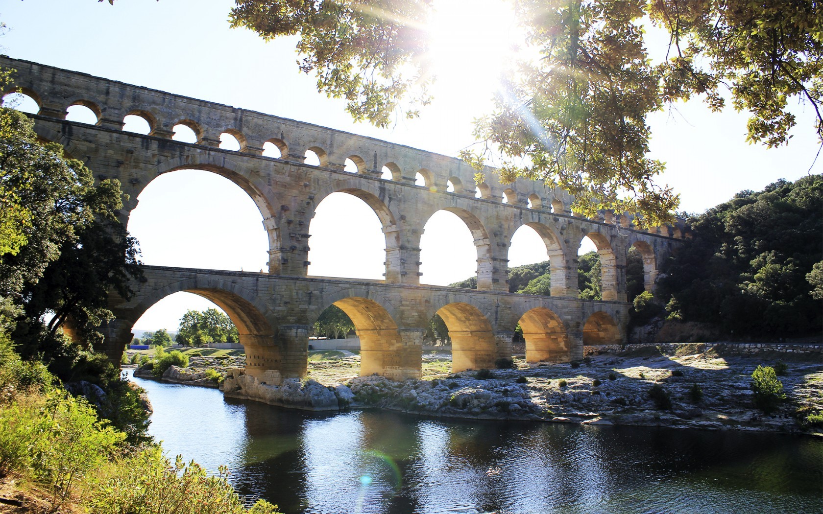General 1680x1050 building old building bridge aqueducts Pont du Gard river landscape trees arch France sunlight