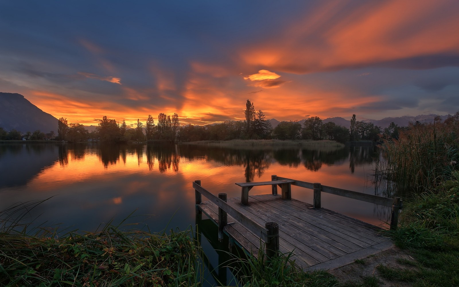 General 1600x1000 nature landscape lake clouds dock trees sky mountains reeds water France orange sky outdoors