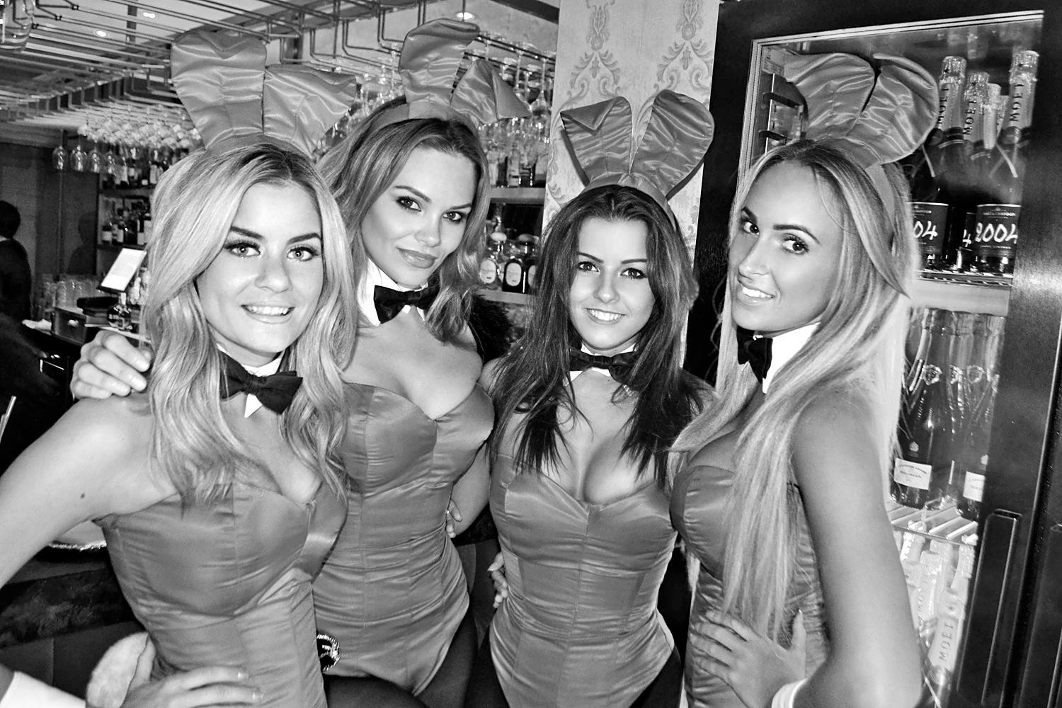 People 1500x1000 monochrome bunny suit Playboy women group of women bunny ears looking at viewer smiling boobs