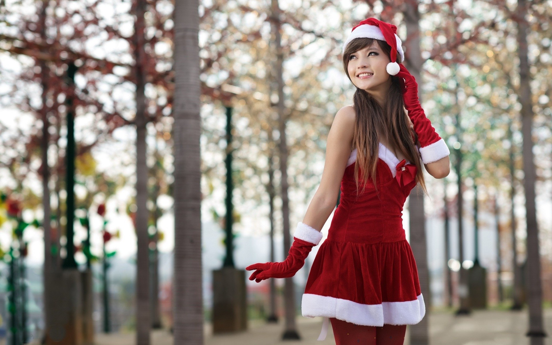 People 1920x1200 women Asian long hair auburn hair Santa Claus Santa costume Christmas Agnes Lim standing smiling looking away Santa hats outdoors women outdoors model brunette looking into the distance gloves