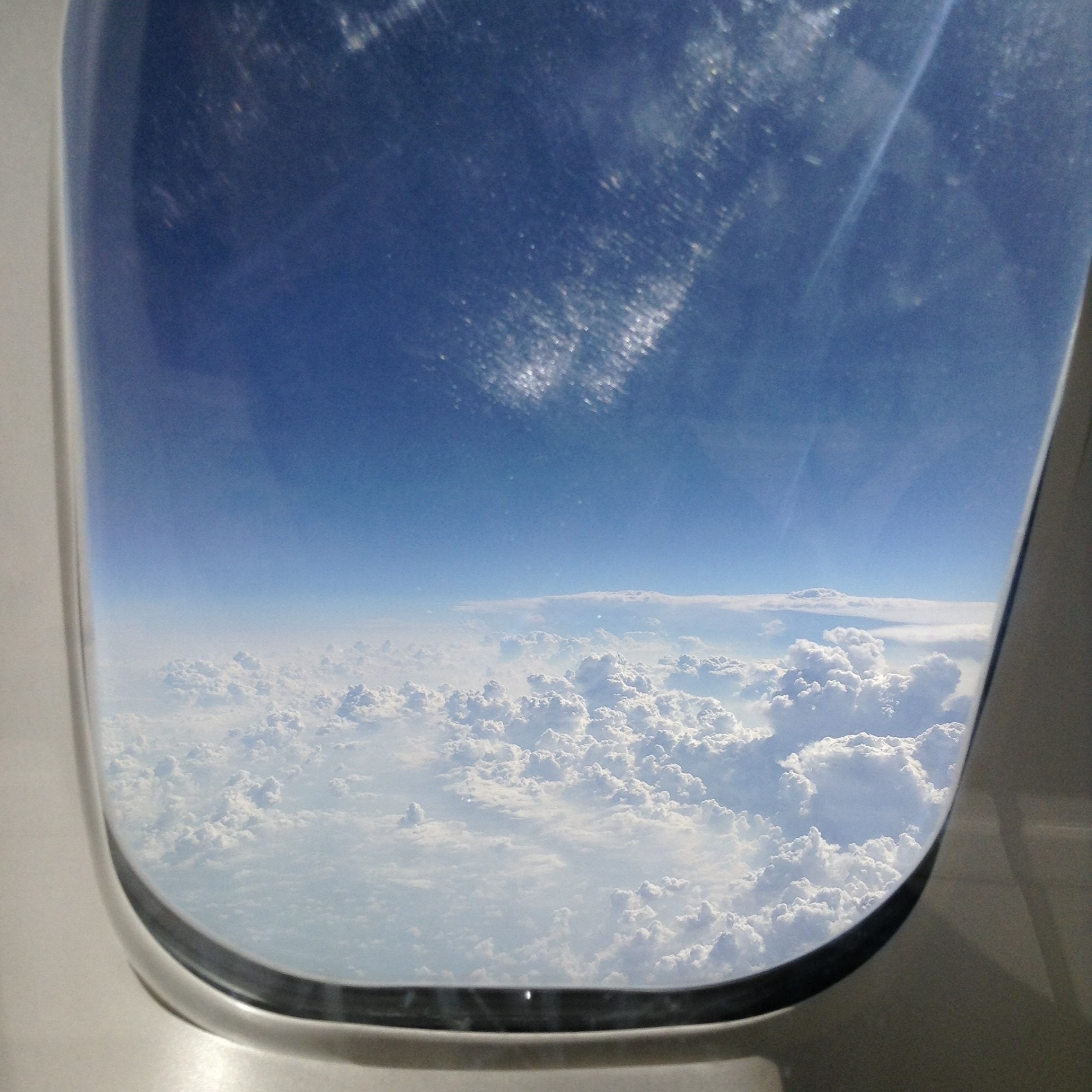 General 1936x1936 airplane window clouds sky looking out window
