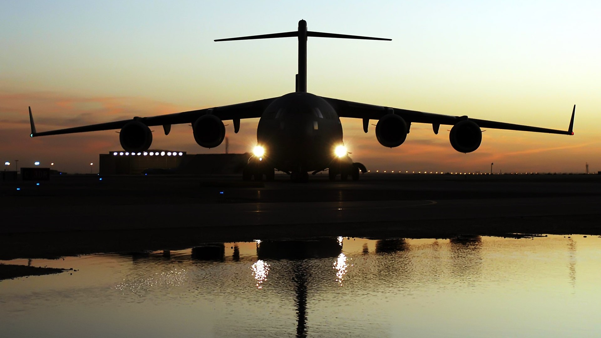 General 1920x1080 military aircraft airplane silhouette aircraft military frontal view vehicle military vehicle Boeing C-17 Globemaster III Boeing American aircraft jets reflection water