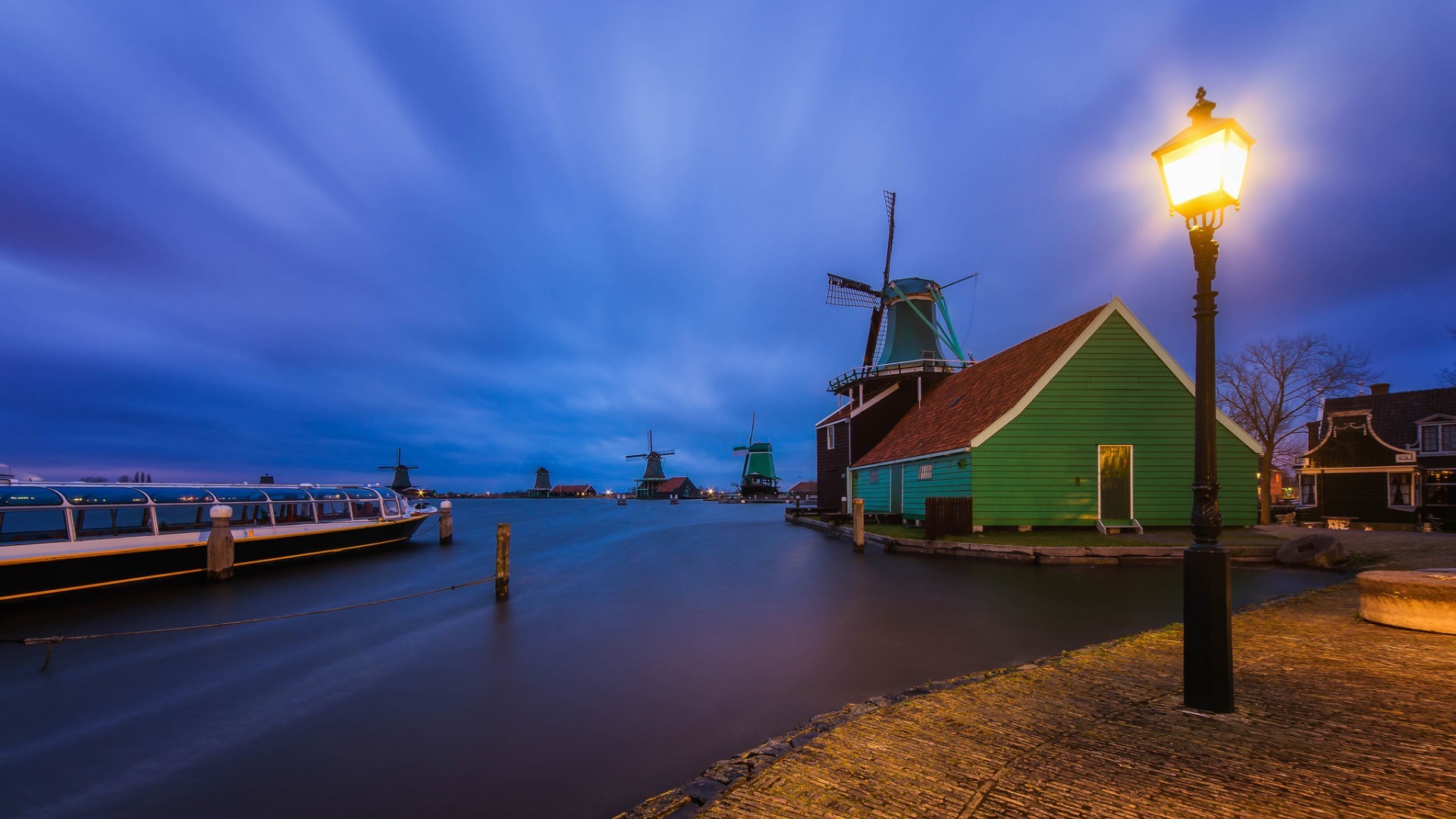 General 1920x1080 evening lights house town clouds Netherlands windmill street light lamp water long exposure boat