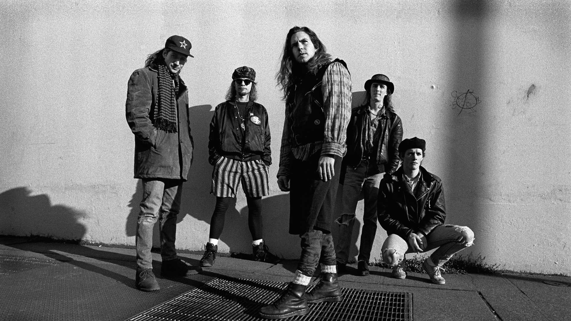 People 1920x1080 men musician rockstar grunge Seattle monochrome long hair street wall shadow rock bands 1990s Doc Martens Pearl Jam Eddie Vedder shorts