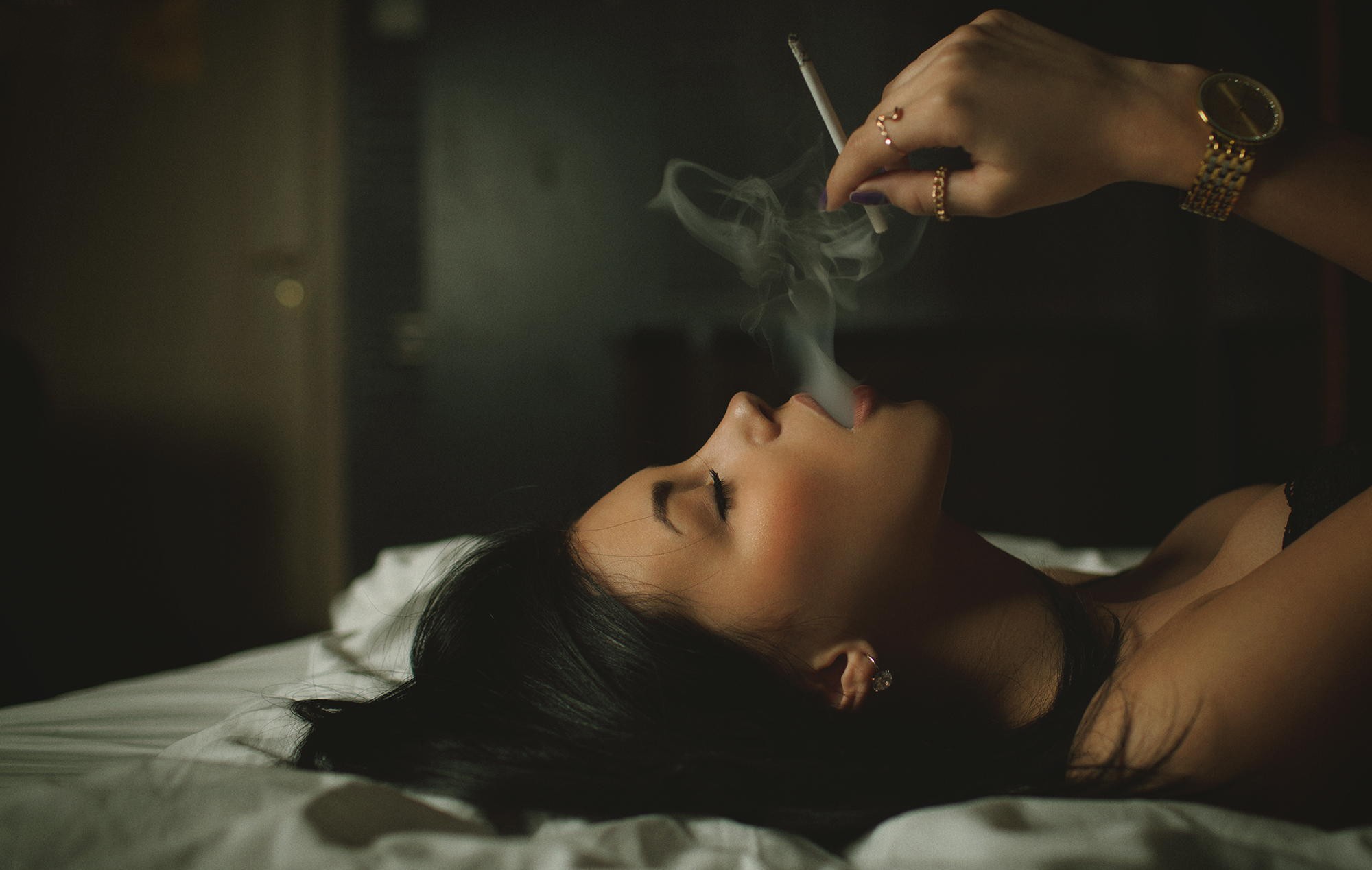 People 2000x1269 smoking women model Aleksandr Mavrin black hair lying on back jewelry in bed Gold Watch women indoors indoors wristwatch closed eyes dark hair open mouth cigarettes closeup