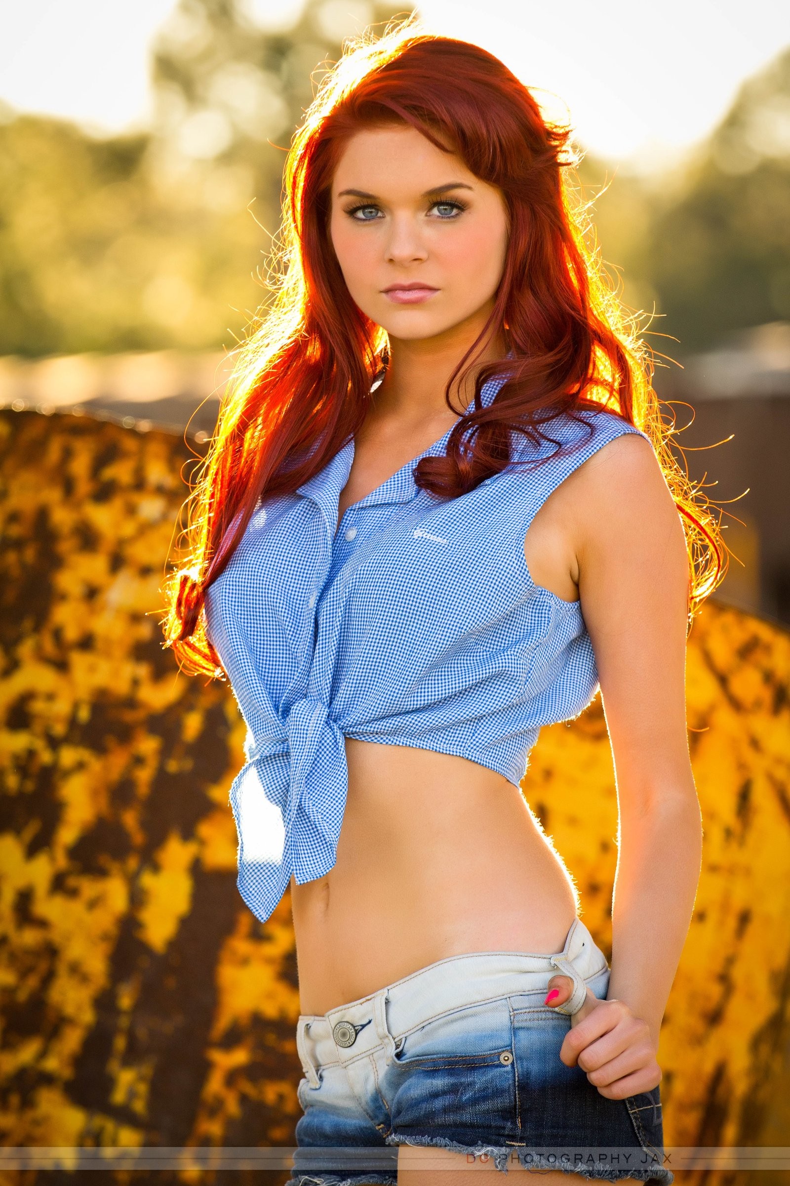 People 1600x2400 women model redhead long hair looking at viewer Karoline Kate women outdoors portrait display blue eyes jean shorts blouses sunlight torn jeans nature belly bare midriff dyed hair makeup standing