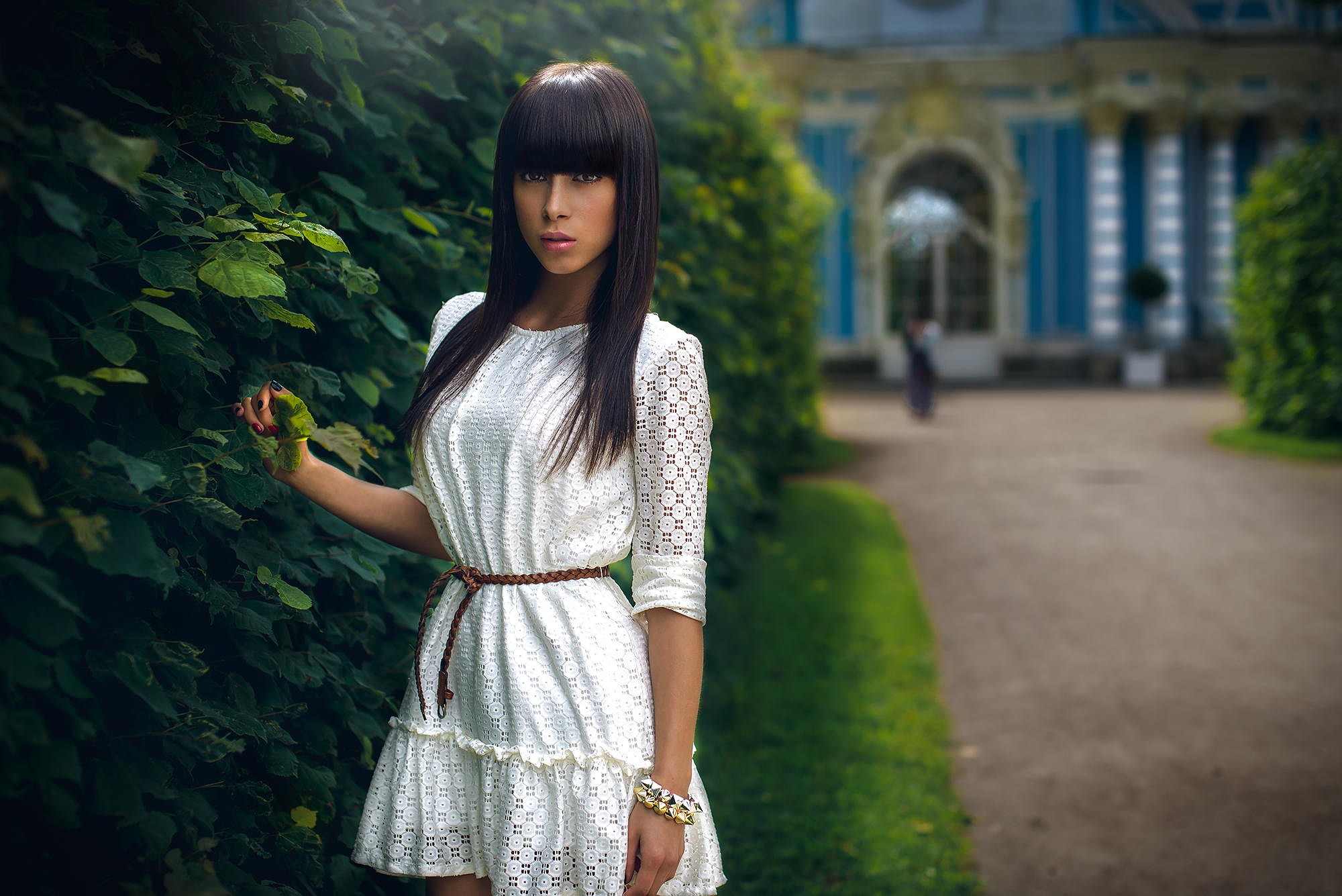 People 2000x1335 women model brown eyes bangs Sergey Alexandrov 500px standing black hair plants painted nails looking at viewer white dress white clothing long hair bracelets