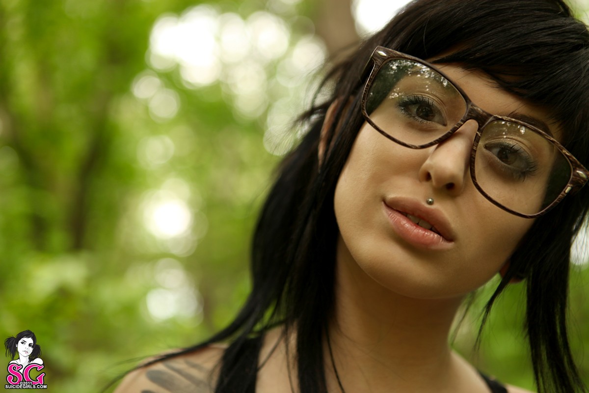 People 1200x800 Suicide Girls women with glasses piercing women model women outdoors outdoors face dark hair glasses looking at viewer 2011 (Year)
