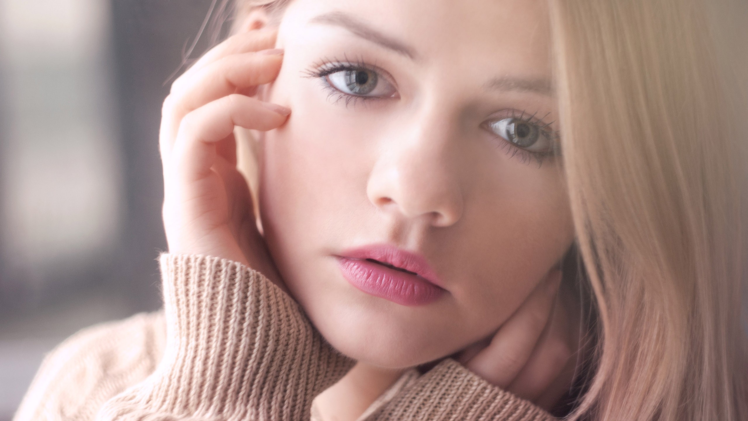 People 2560x1440 closeup blonde eyes women blue eyes looking at viewer face hand on face portrait model hands sweater lipstick women indoors indoors